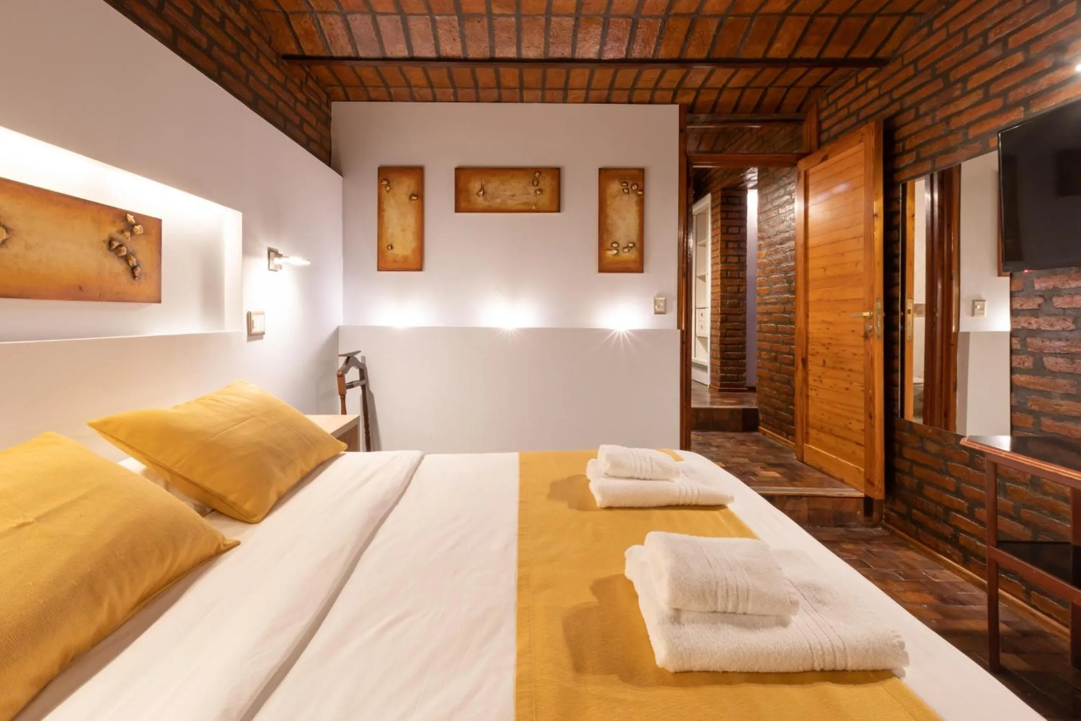 Bed in Portal del Lago Hotel