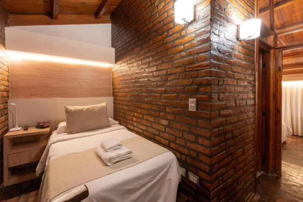 Bed in Portal del Lago Hotel