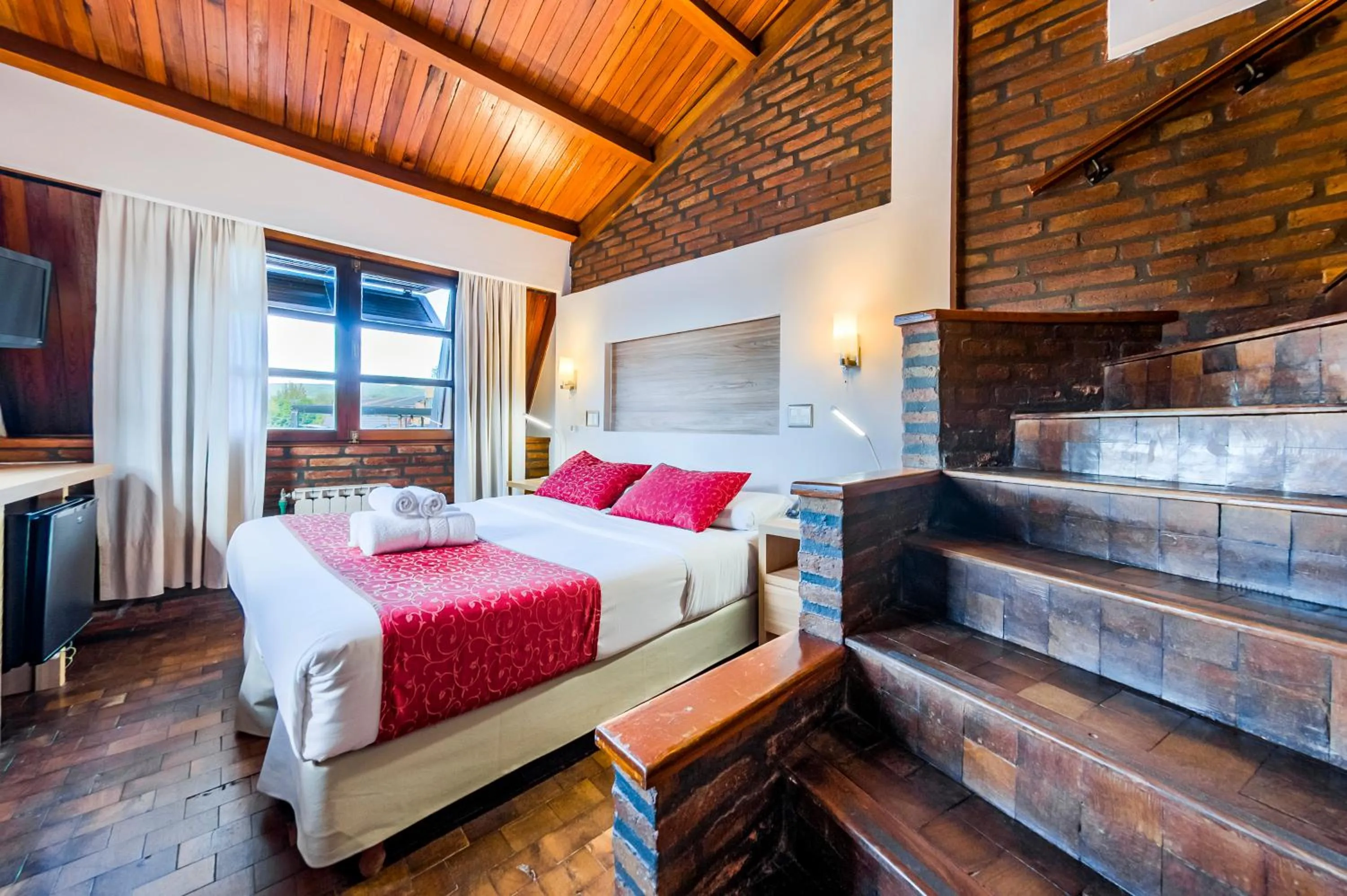 Bed in Portal del Lago Hotel