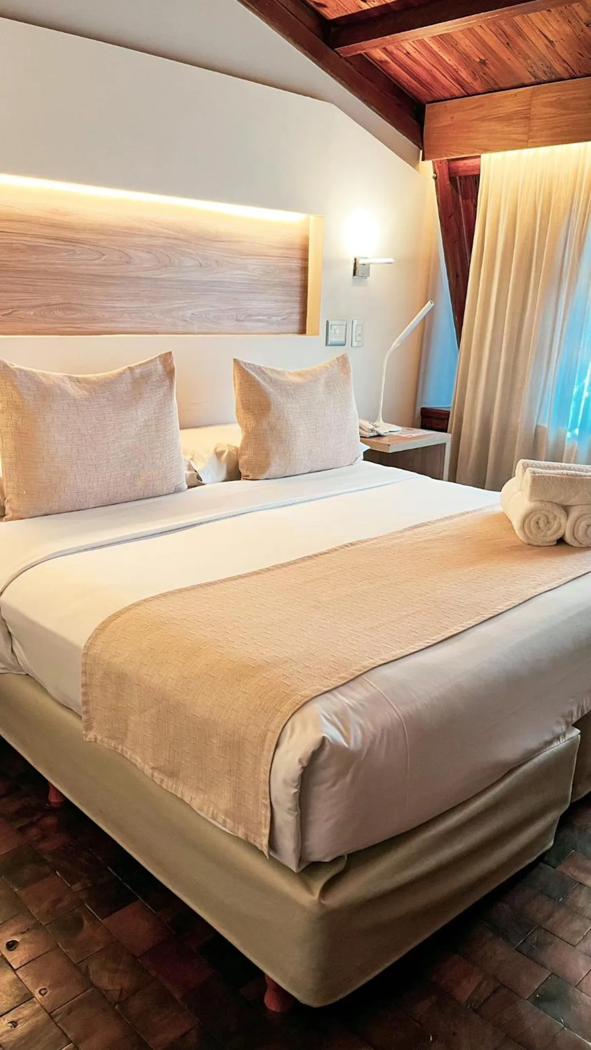 Bed in Portal del Lago Hotel