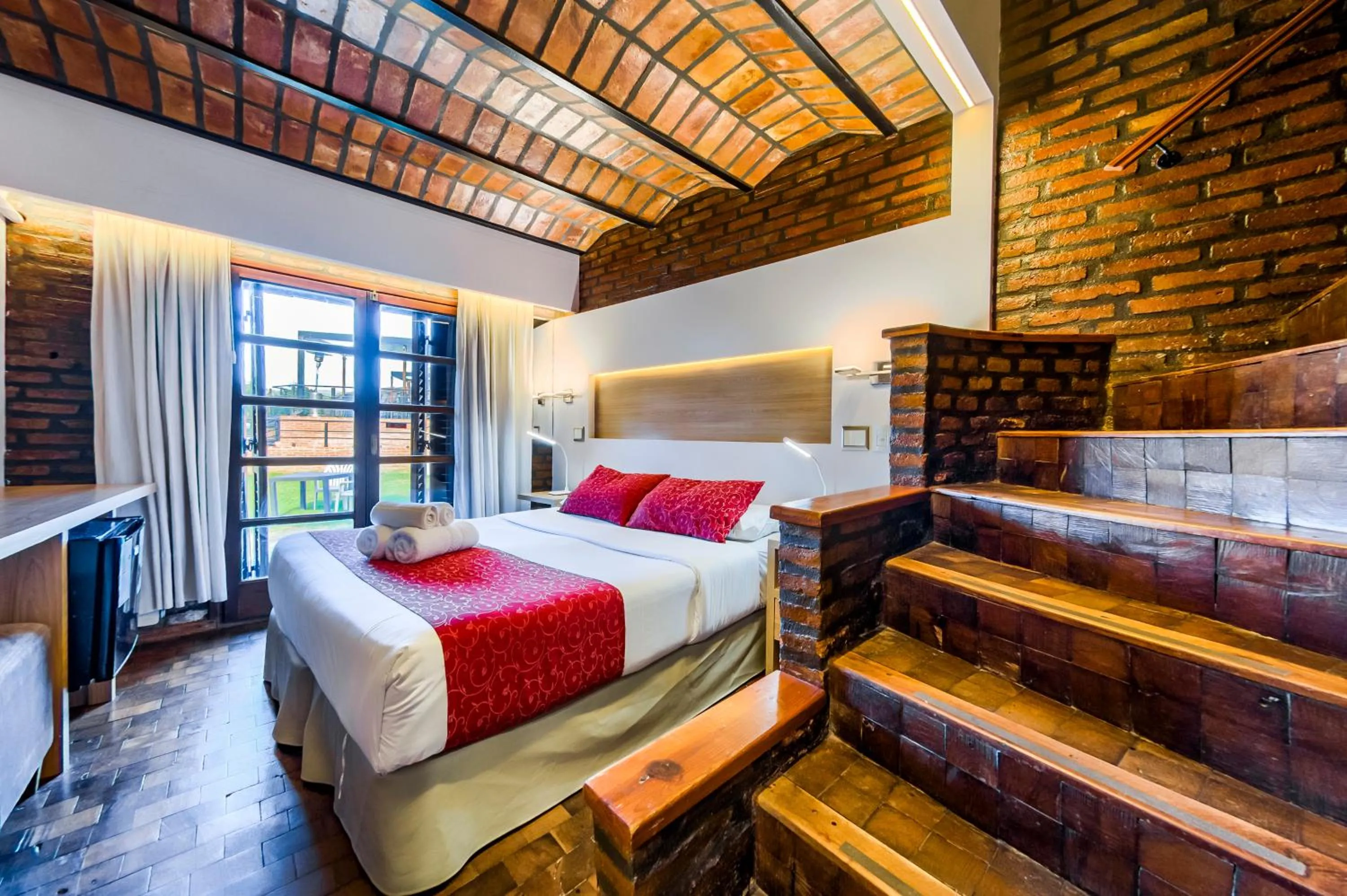 Bed in Portal del Lago Hotel