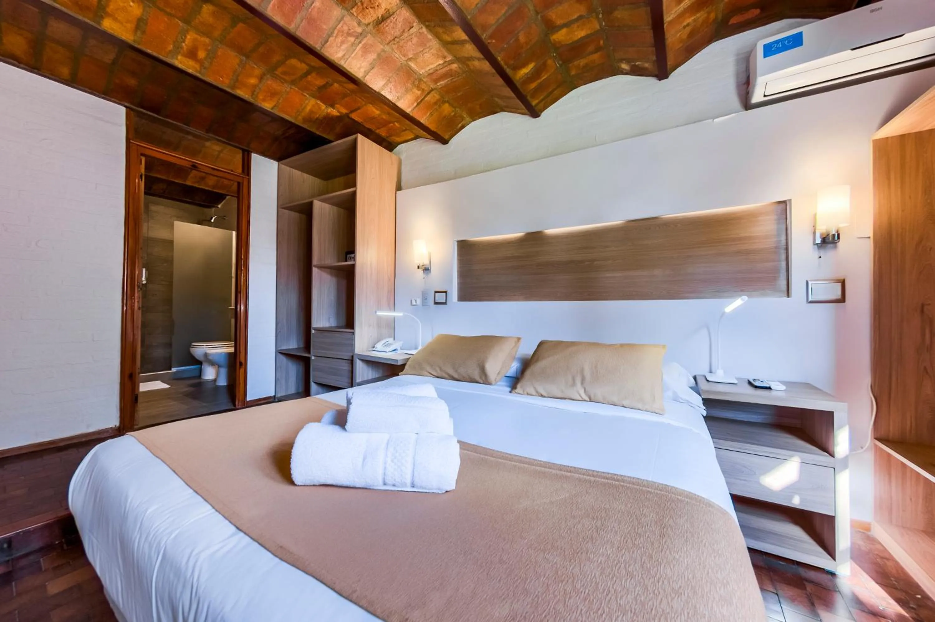 Bed in Portal del Lago Hotel