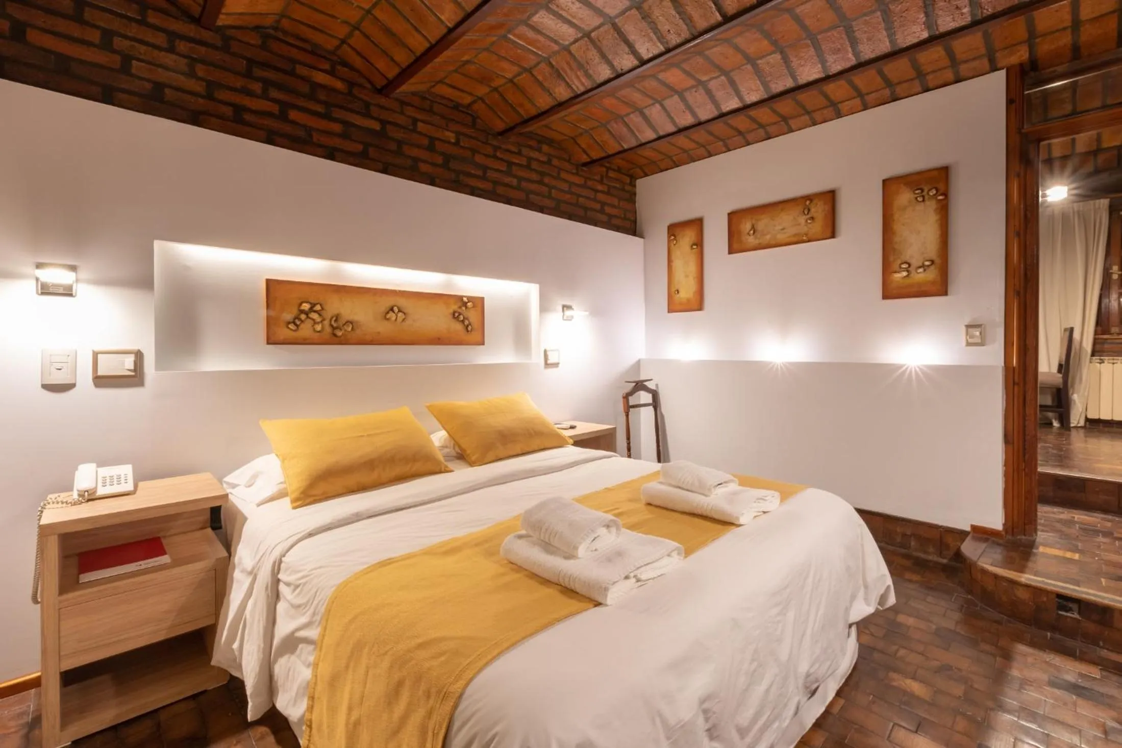 Bed in Portal del Lago Hotel