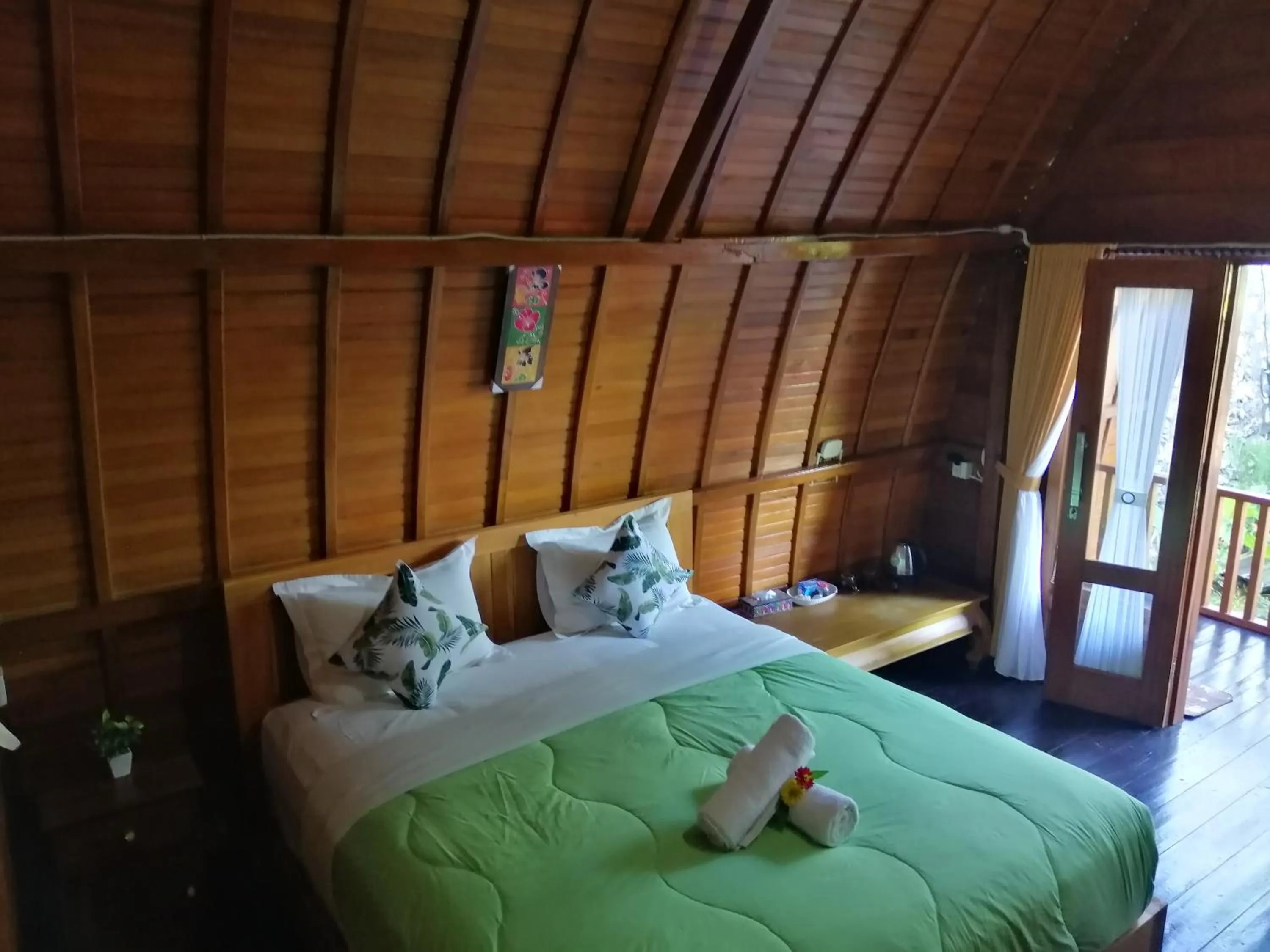 Bed in Ginanthi Cottage