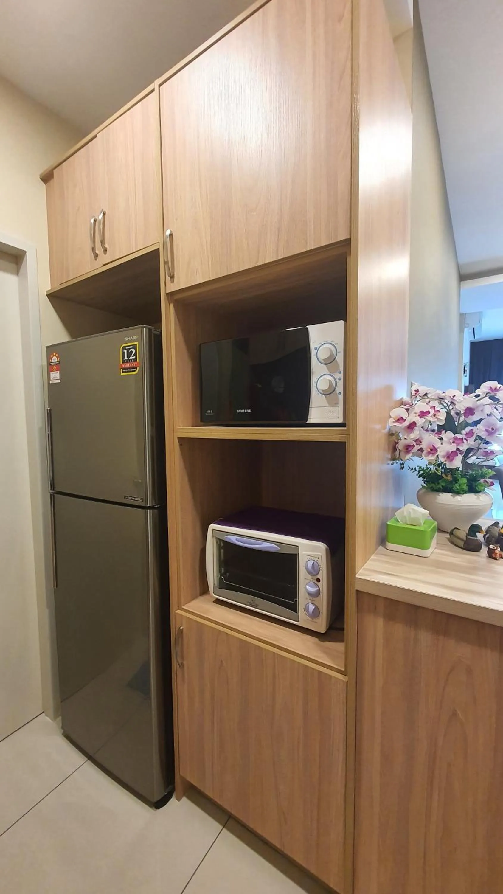 Kitchen or kitchenette in Southville Stay @ Savanna Executive Suite