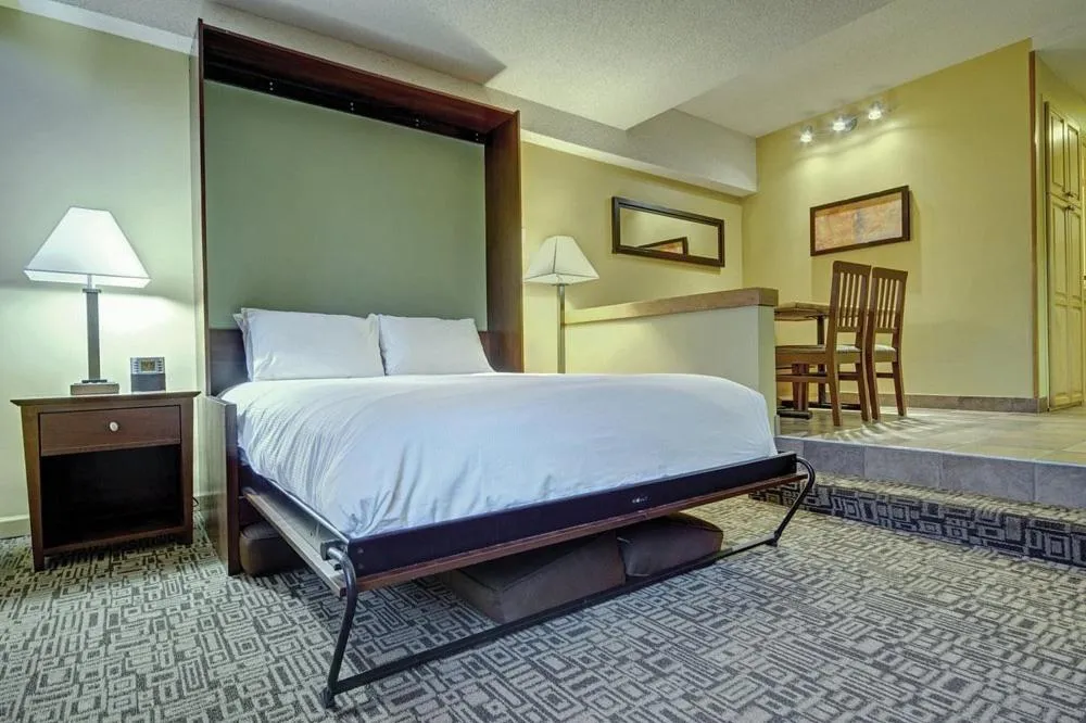 Bed in Mountain Side Hotel Whistler by Executive