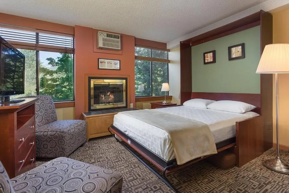 Bed in Mountain Side Hotel Whistler by Executive