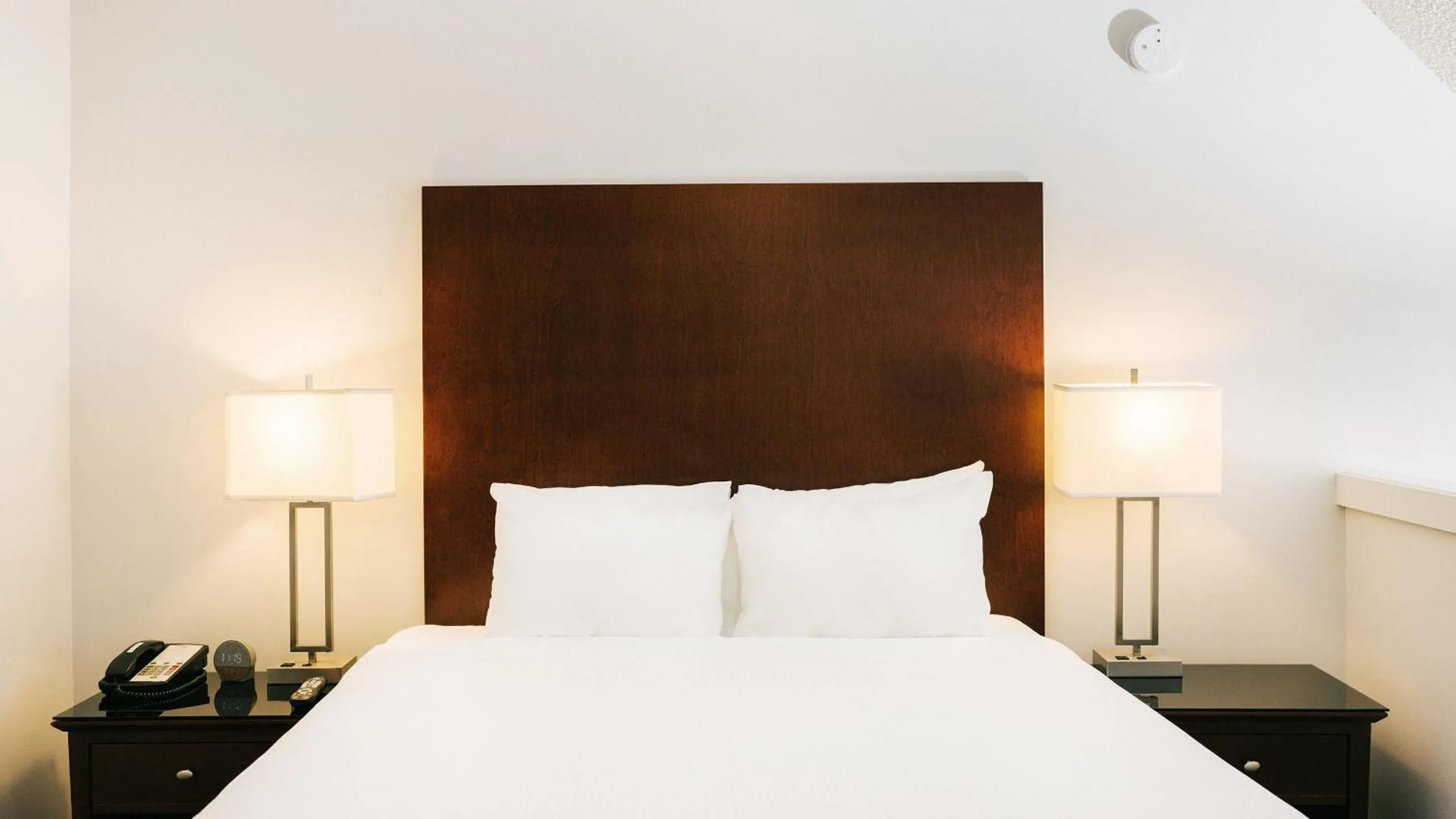 Bed in Mountain Side Hotel Whistler by Executive