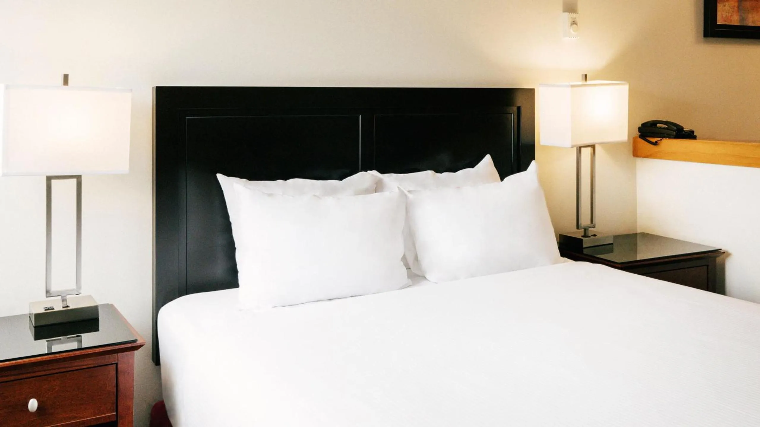 Bed in Mountain Side Hotel Whistler by Executive