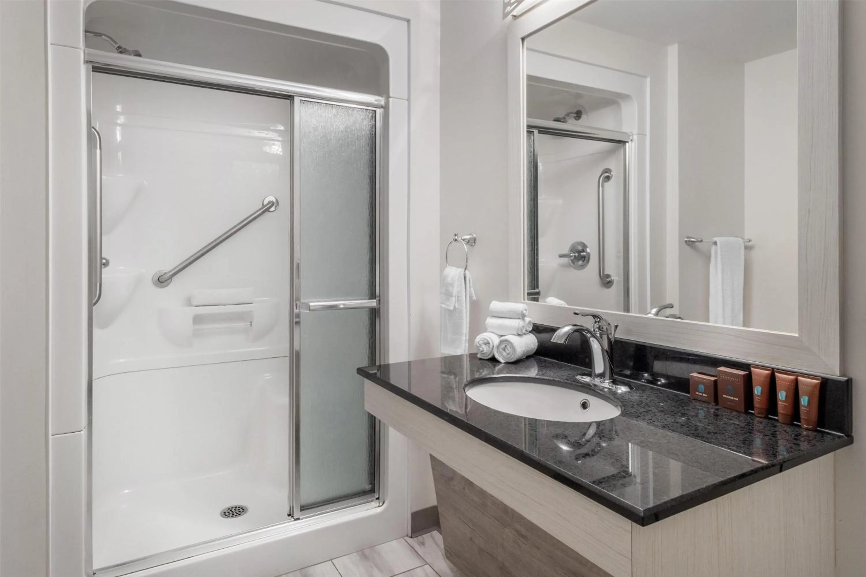 Bathroom in Dannys Suites, SureStay Collection by Best Western
