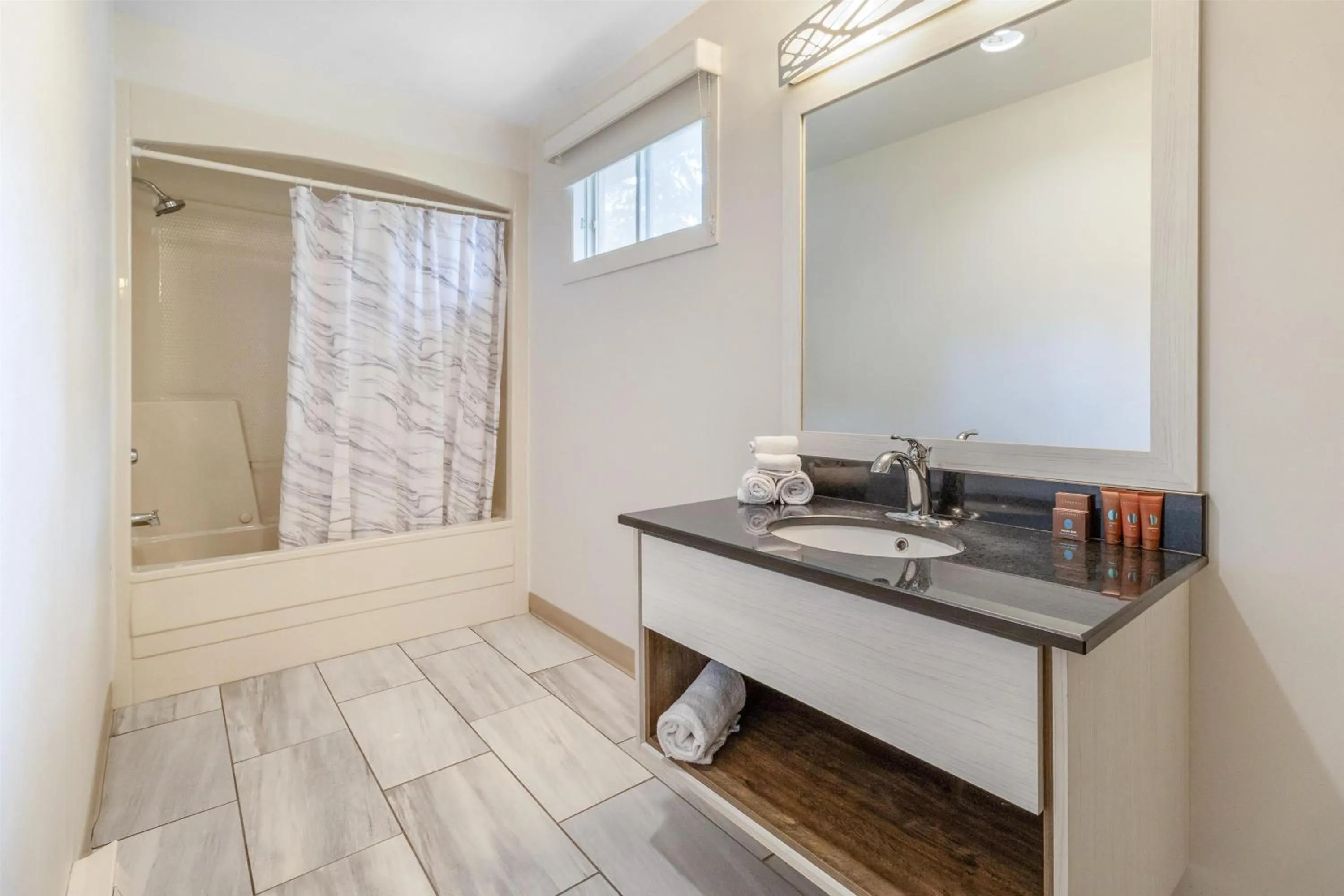 Bathroom in Dannys Suites, SureStay Collection by Best Western