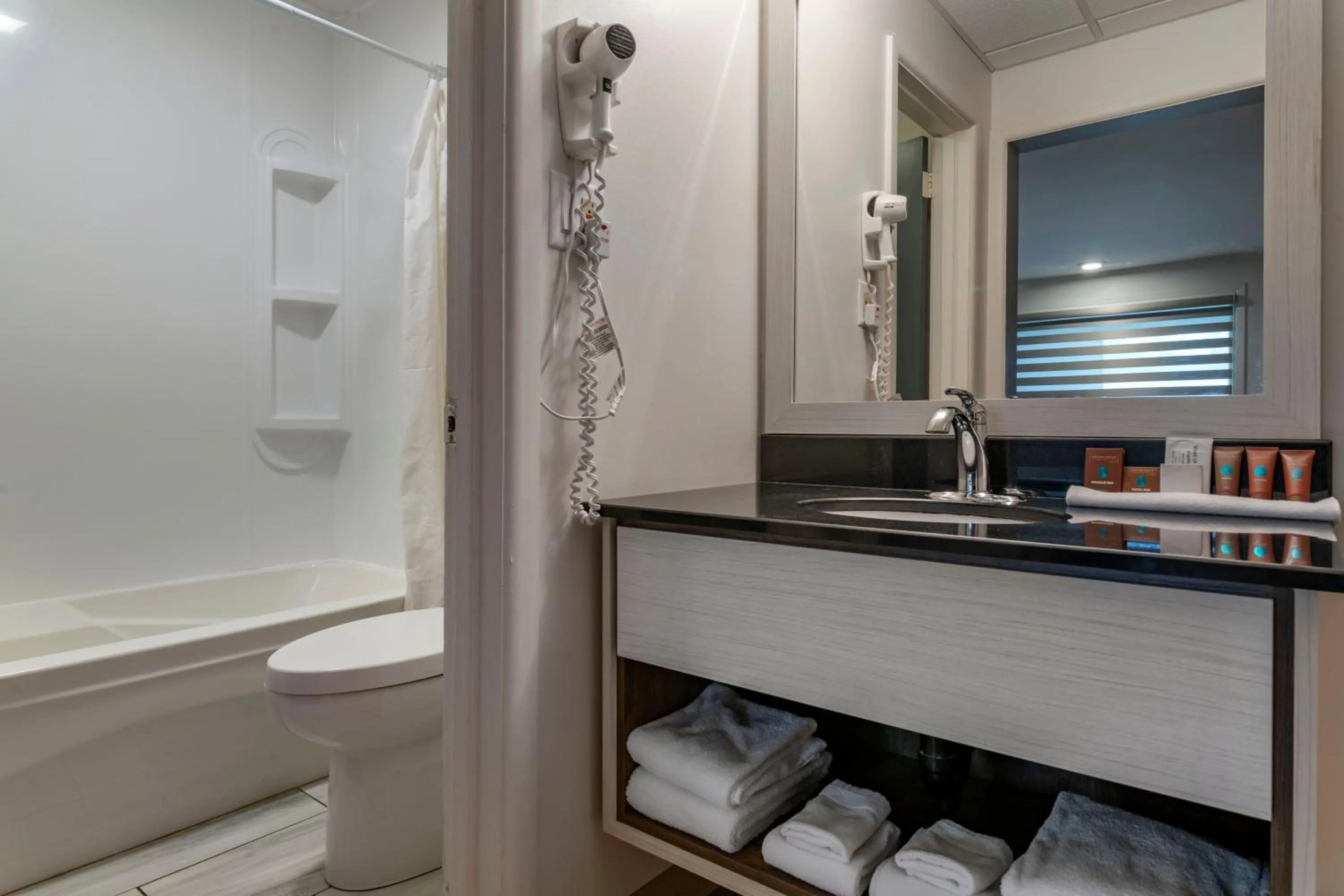 Bathroom in Dannys Suites, SureStay Collection by Best Western