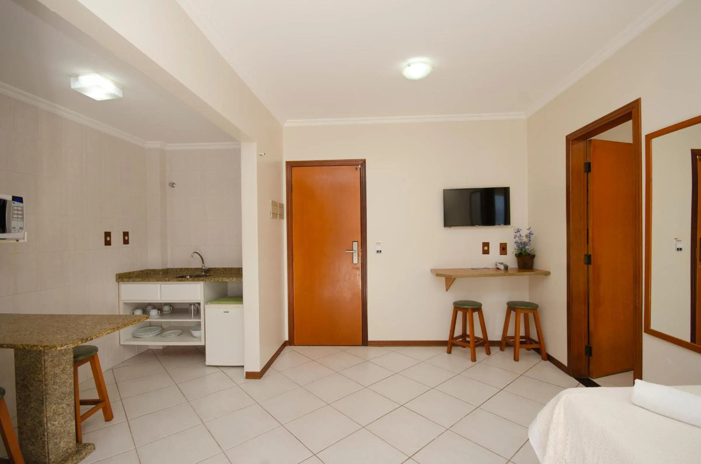 Kitchen or kitchenette, Bed in Pousada Garatéia