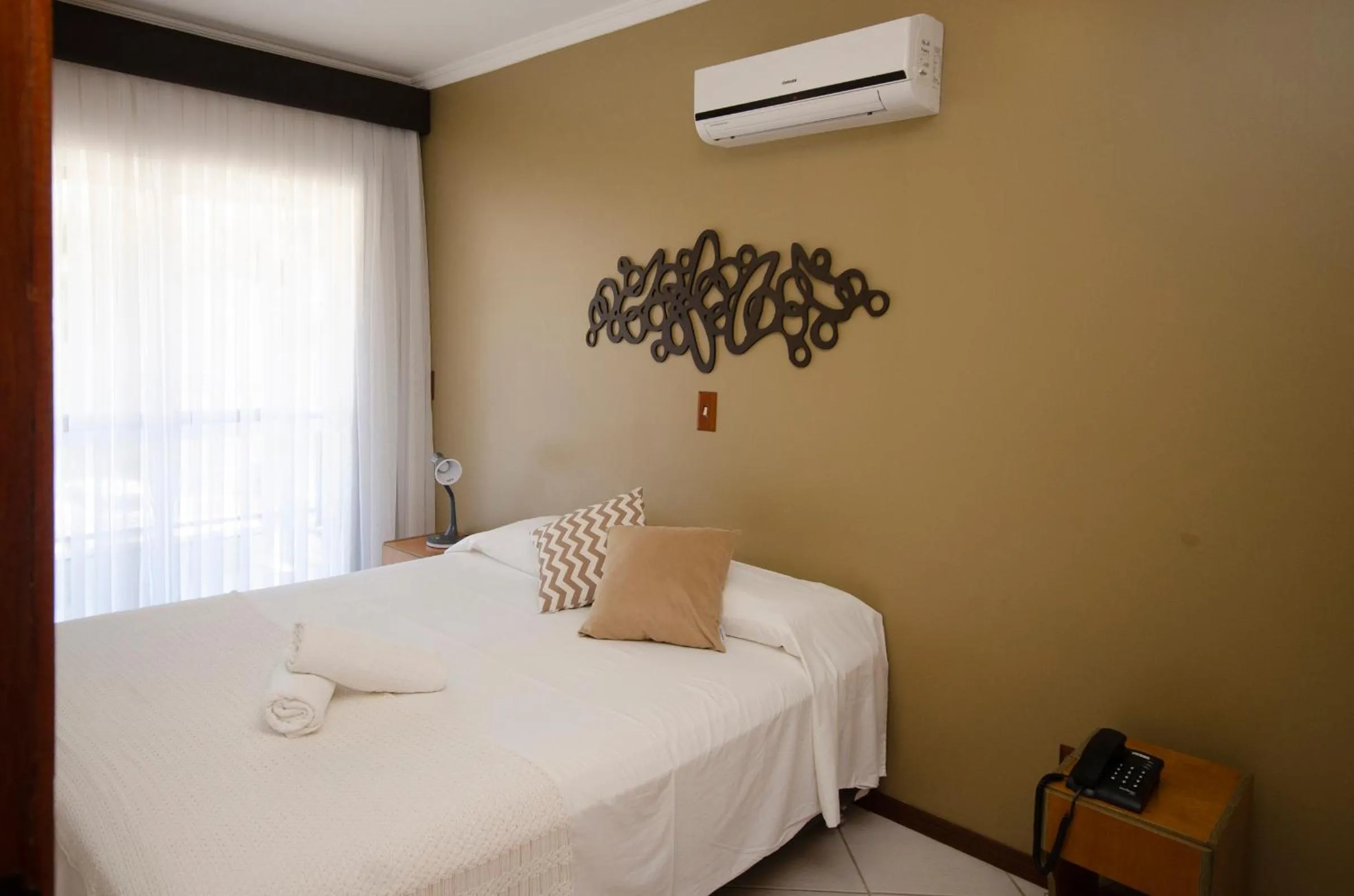 Bed in Pousada Garatéia