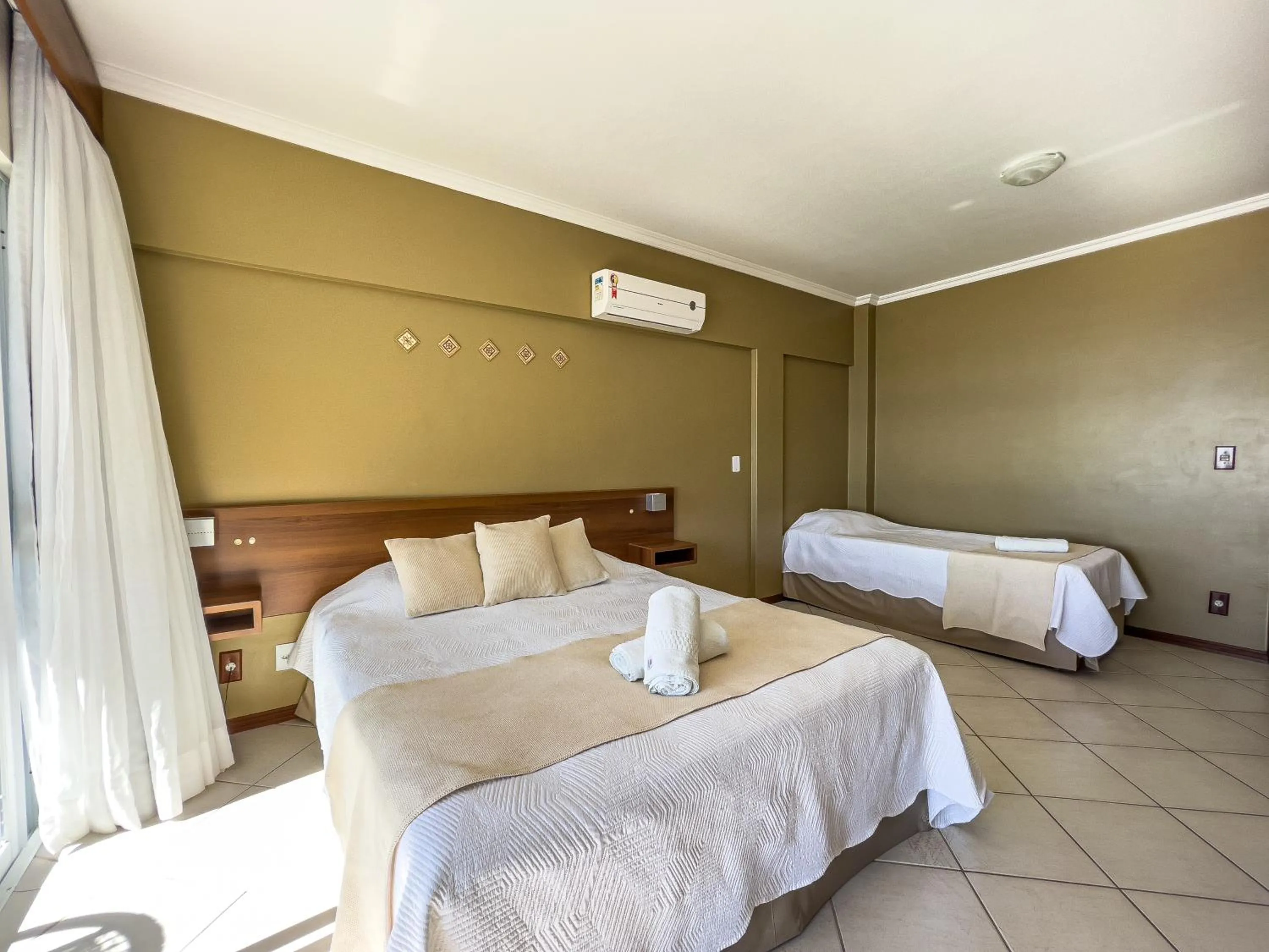 Bed in Pousada Garatéia