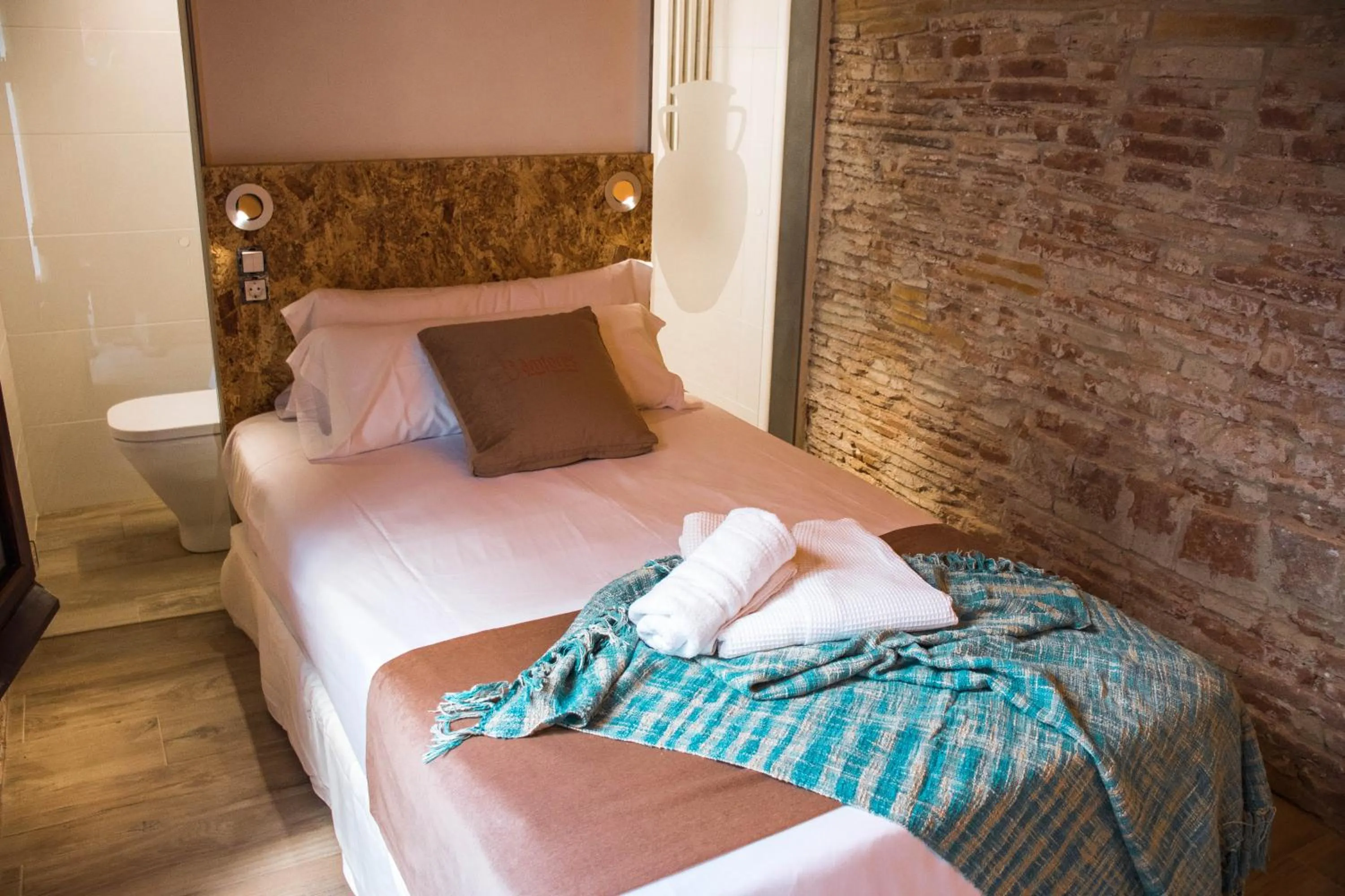 Bed in Àmfores Boutique Guest House