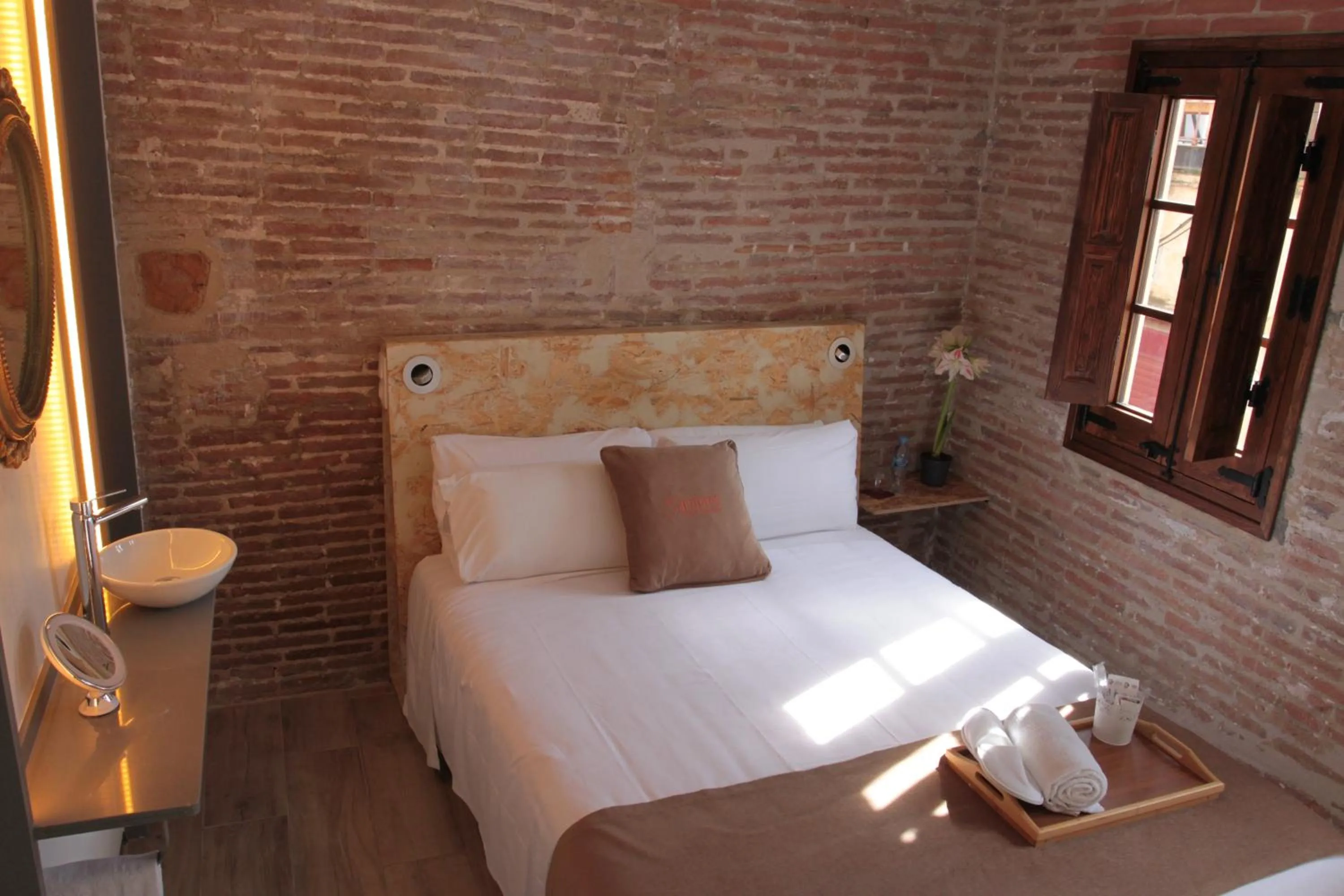 Bed in Àmfores Boutique Guest House