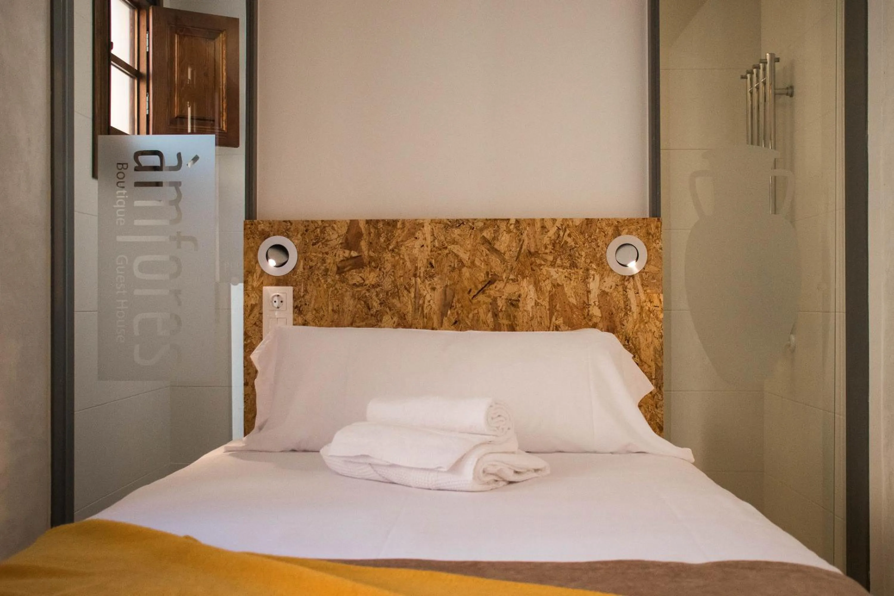 Bed in Àmfores Boutique Guest House