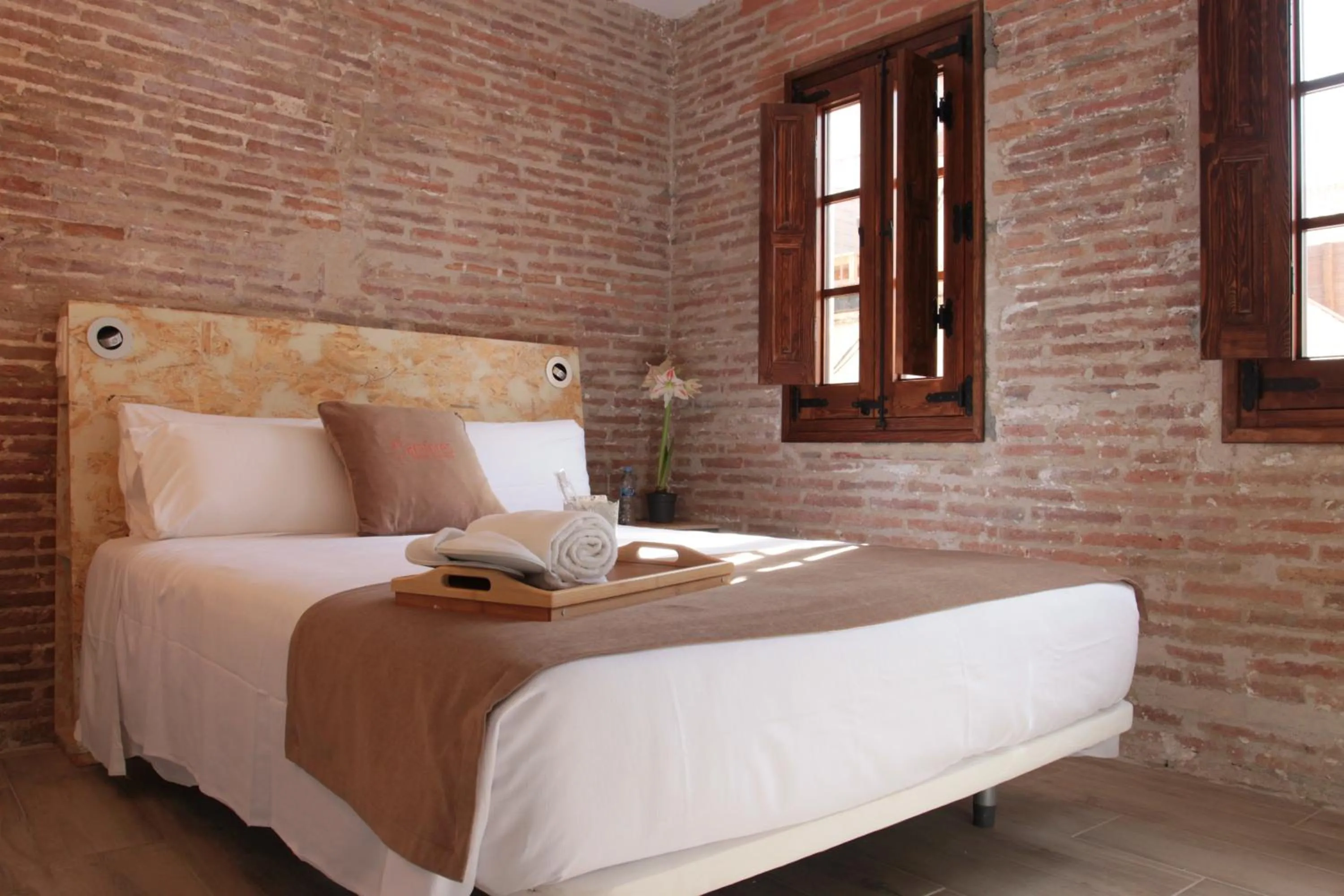 Bed in Àmfores Boutique Guest House