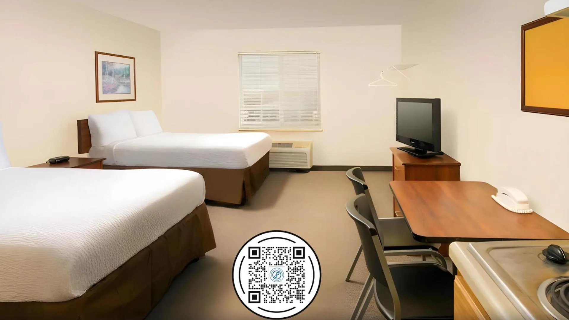 Bed in WoodSpring Suites Houston Baytown