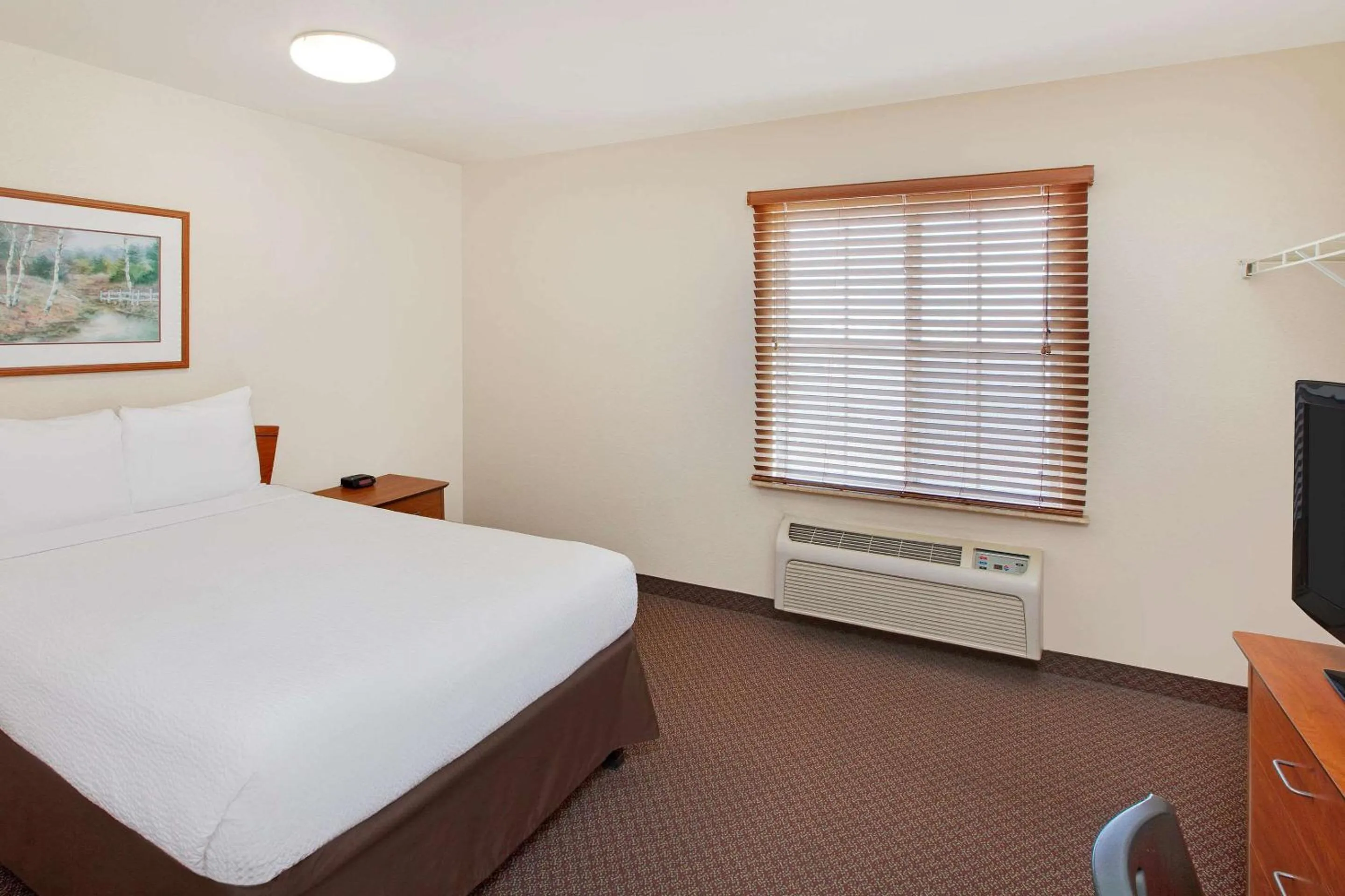 Photo of the whole room, Bed in WoodSpring Suites Houston I-10 West