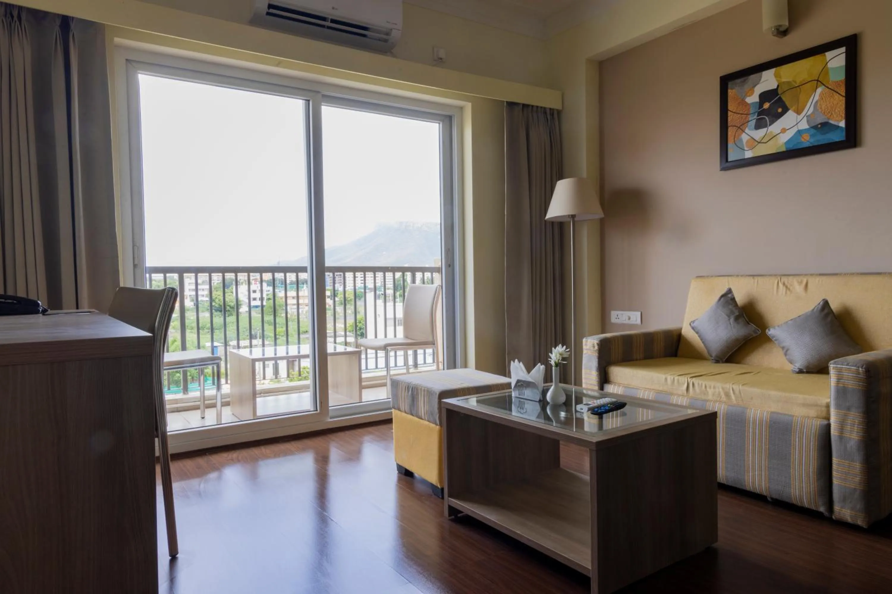 Living room, Bed in Starlit Suites Tirupati