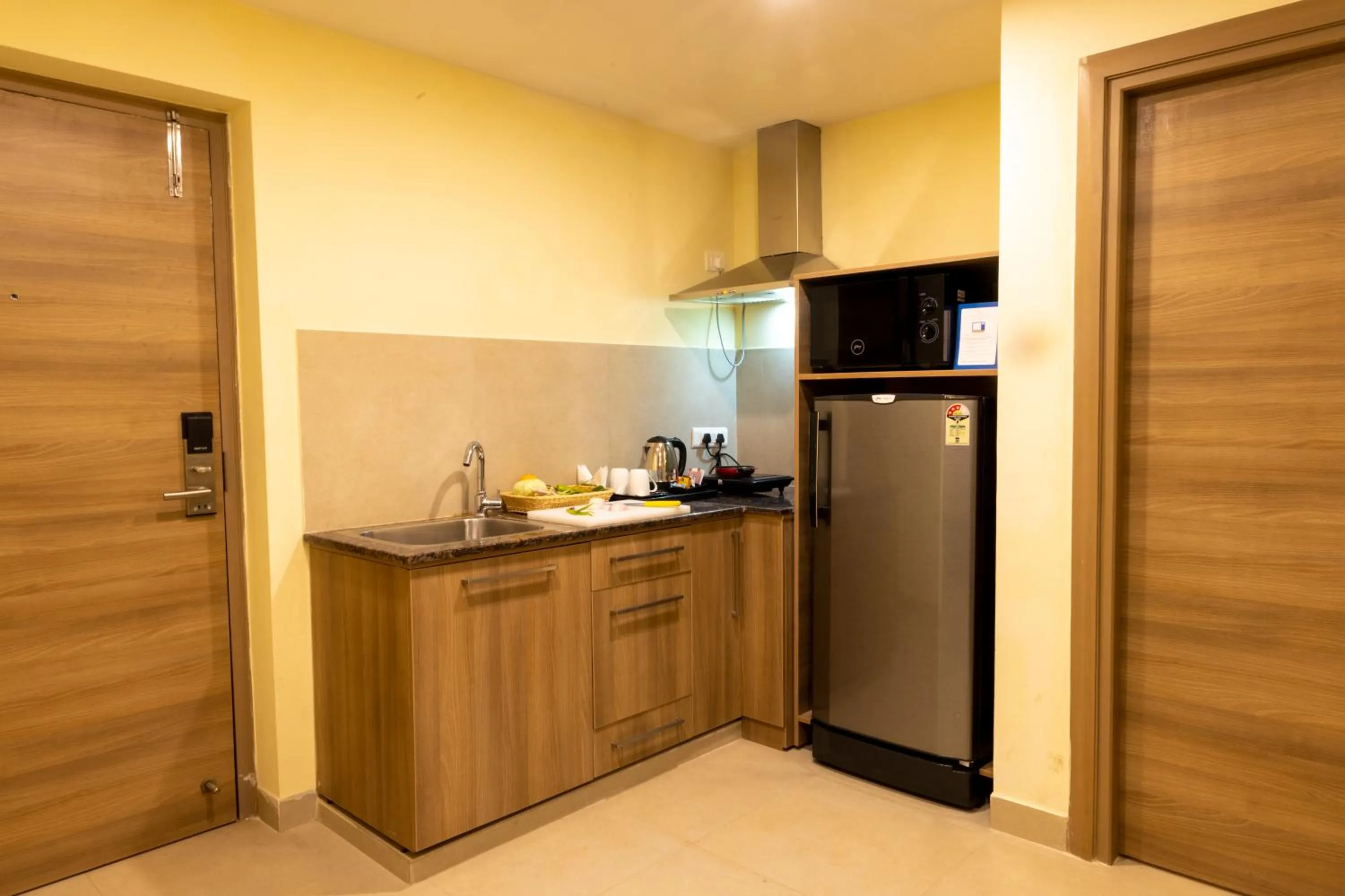 Kitchen or kitchenette in Starlit Suites Tirupati