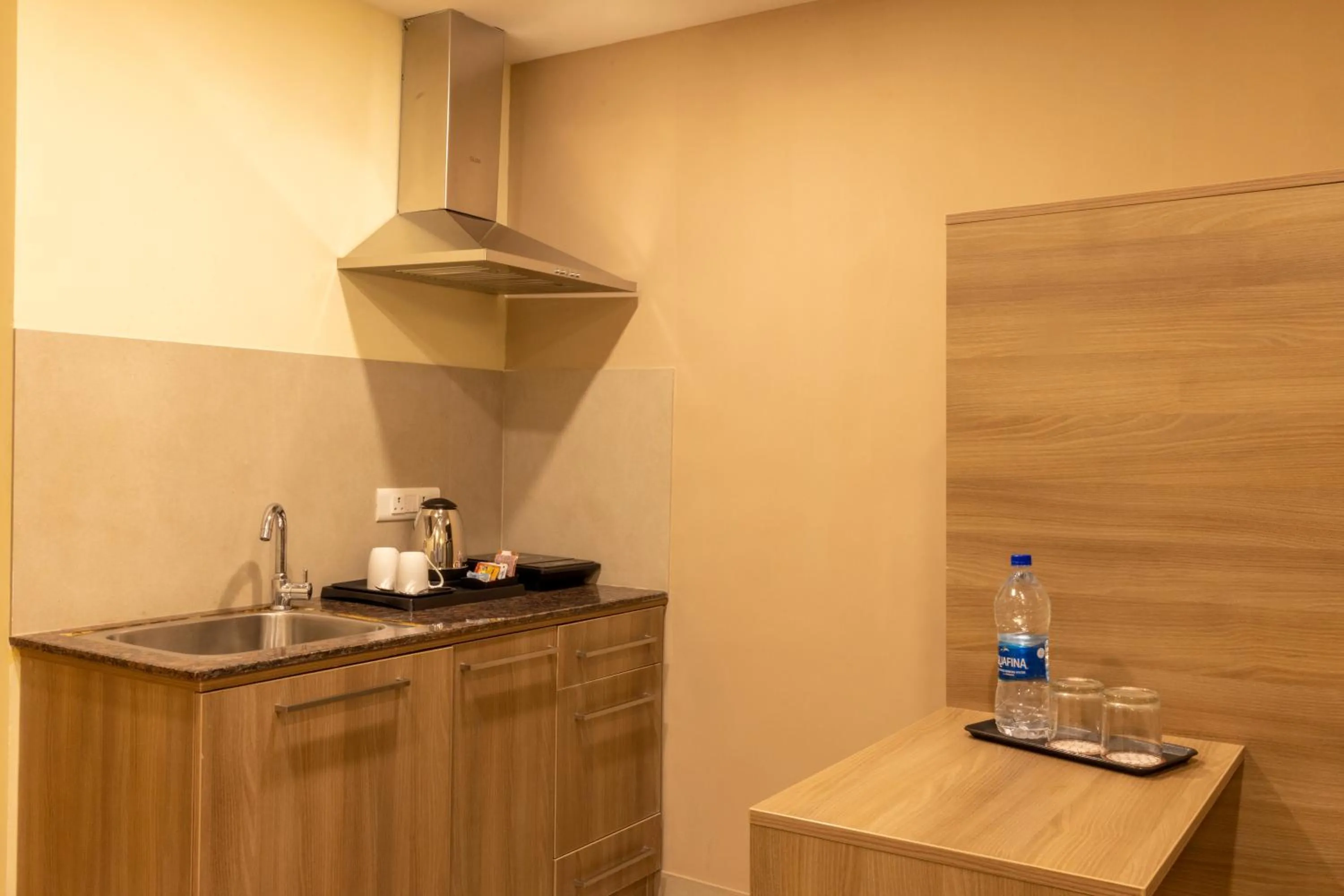 Kitchen or kitchenette in Starlit Suites Tirupati