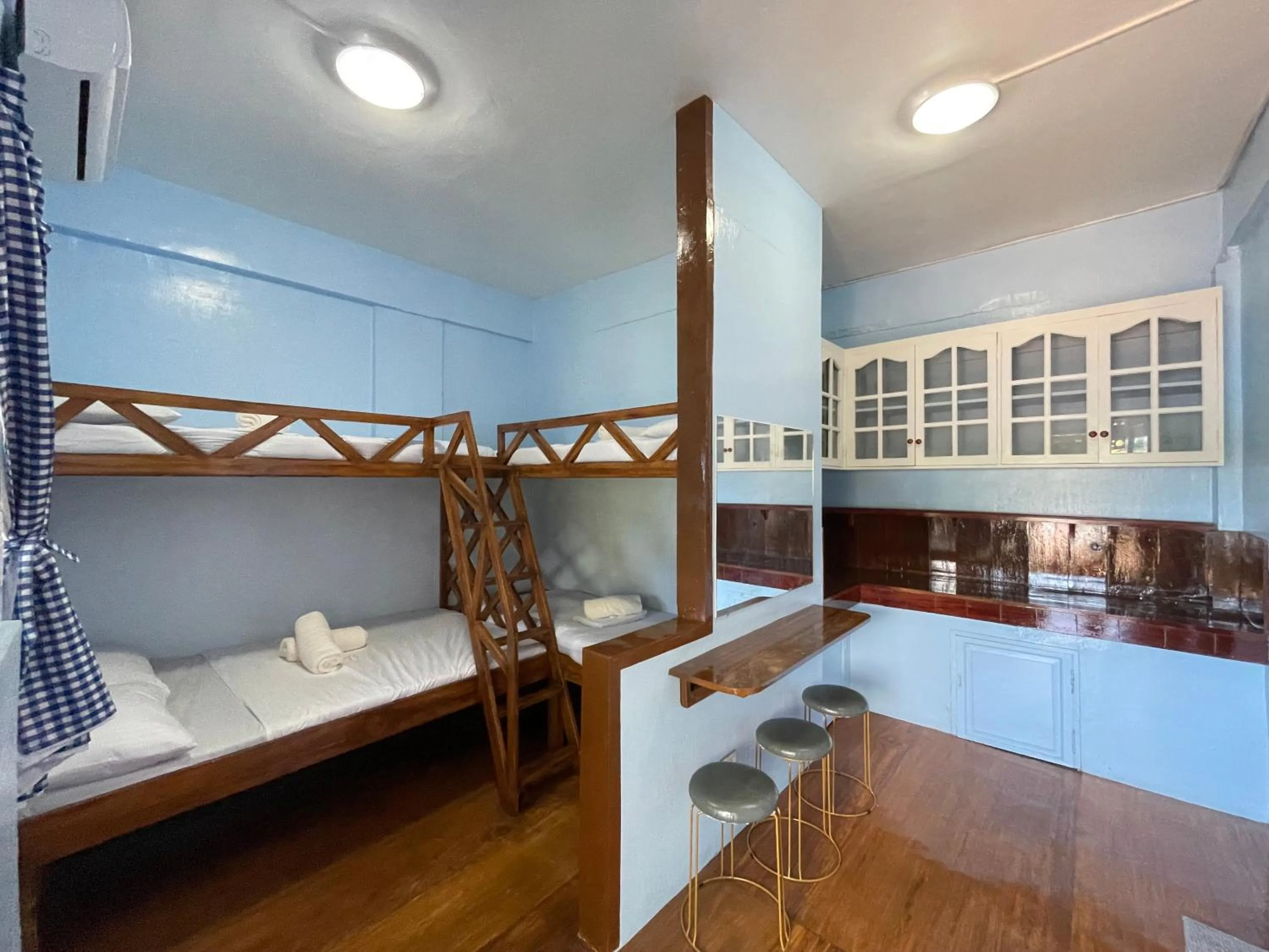 Bed in Camiguin Blue Lagoon Cottages