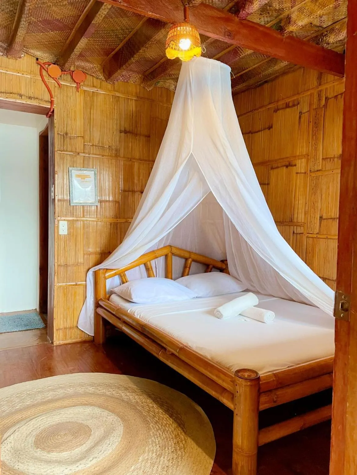 Bed in Camiguin Blue Lagoon Cottages