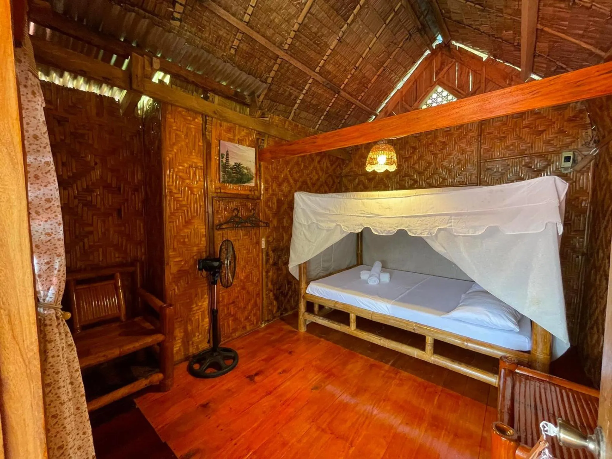 Bed in Camiguin Blue Lagoon Cottages