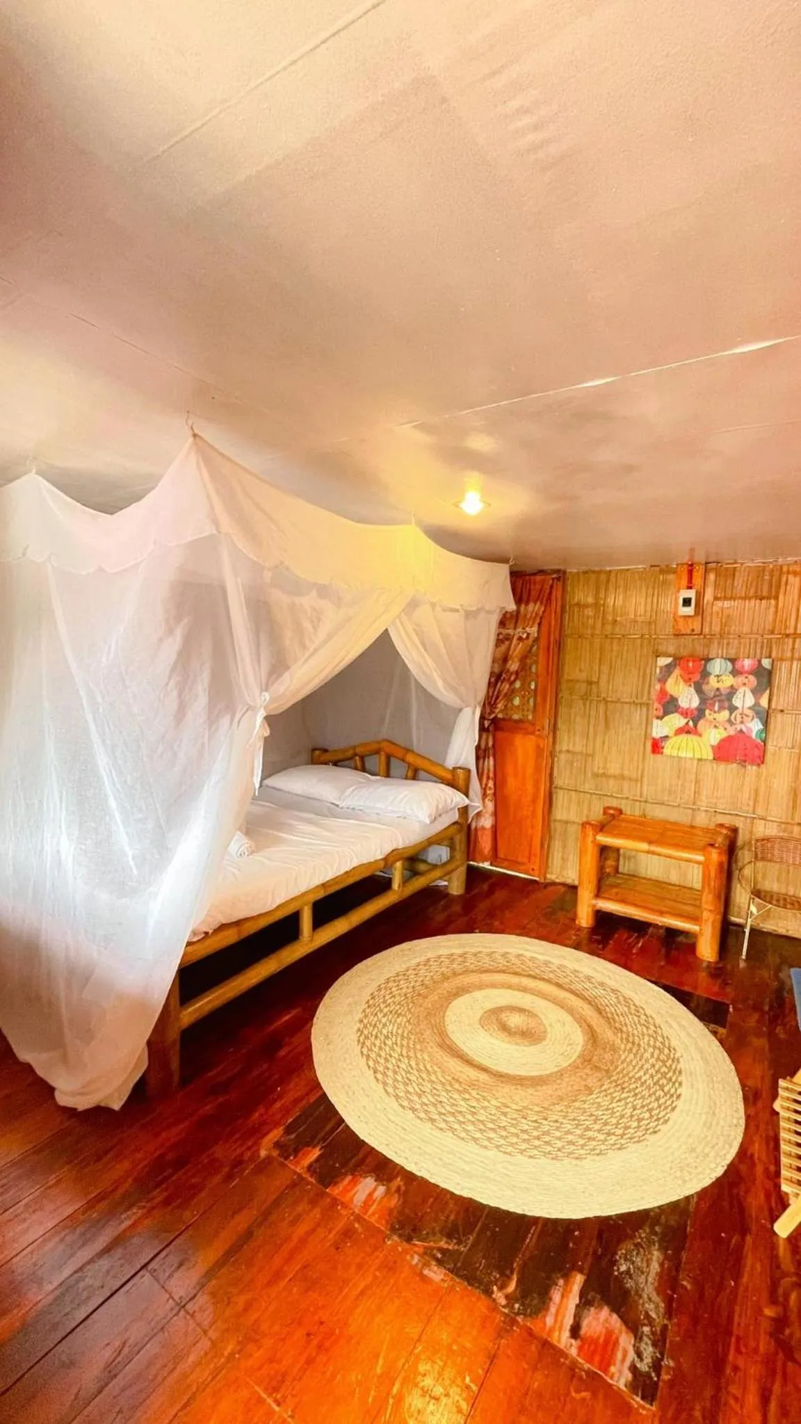 Bed in Camiguin Blue Lagoon Cottages