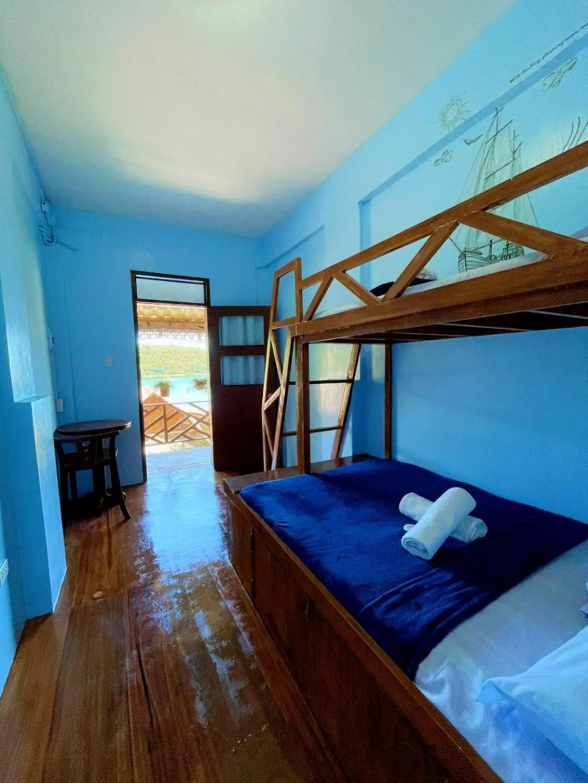 Bed in Camiguin Blue Lagoon Cottages