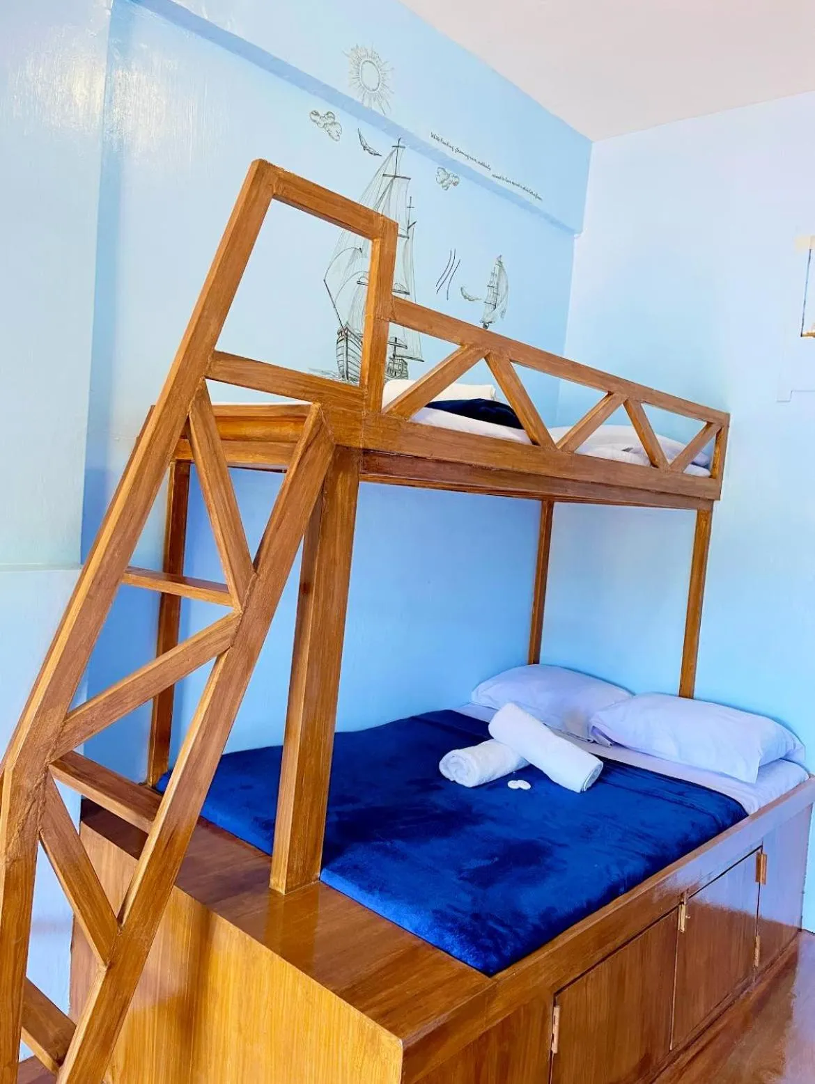 Bed in Camiguin Blue Lagoon Cottages