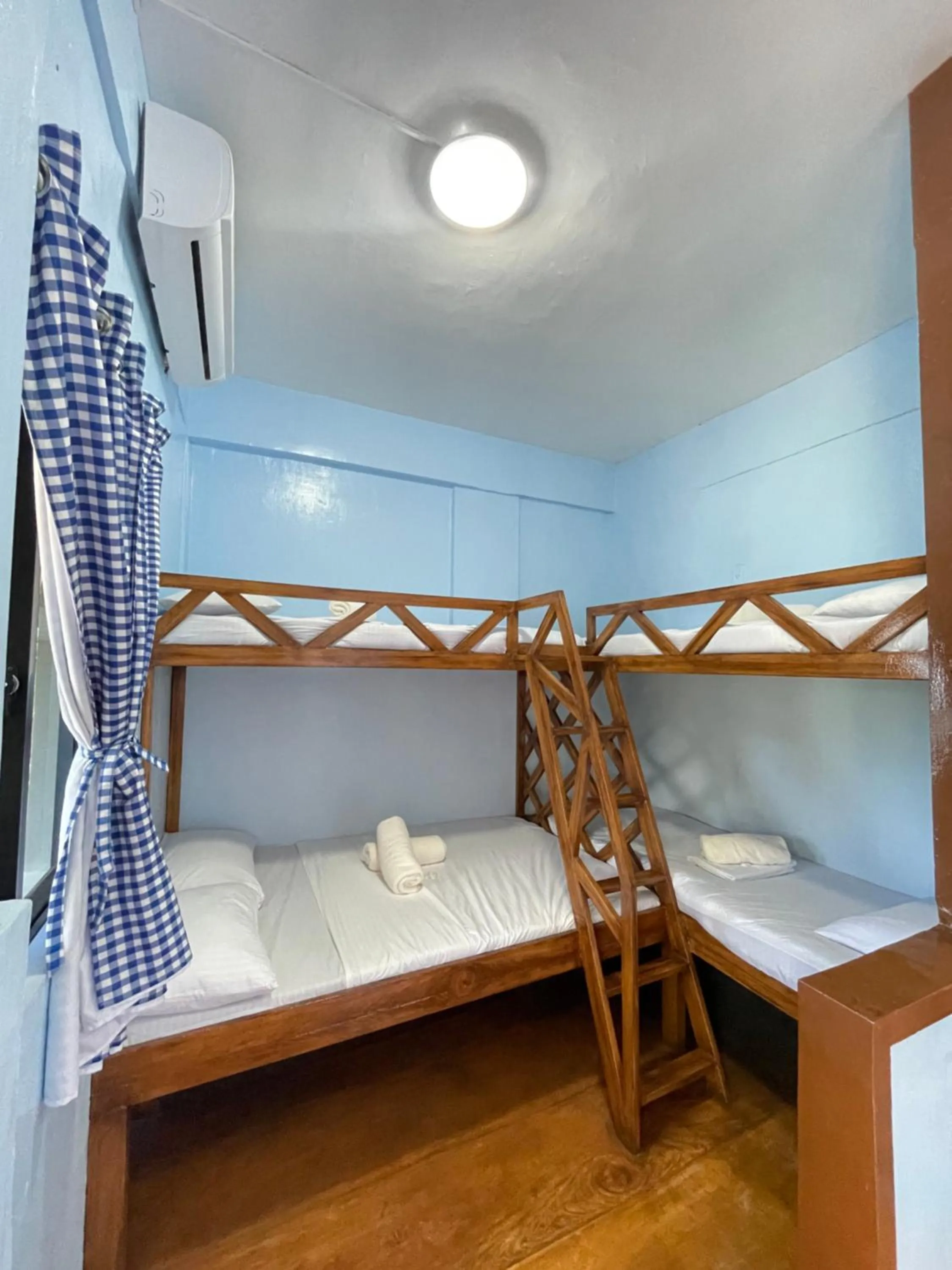 Bed in Camiguin Blue Lagoon Cottages