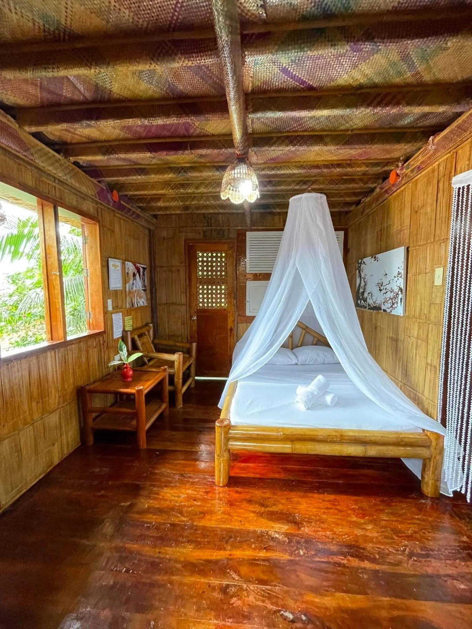 Bed in Camiguin Blue Lagoon Cottages