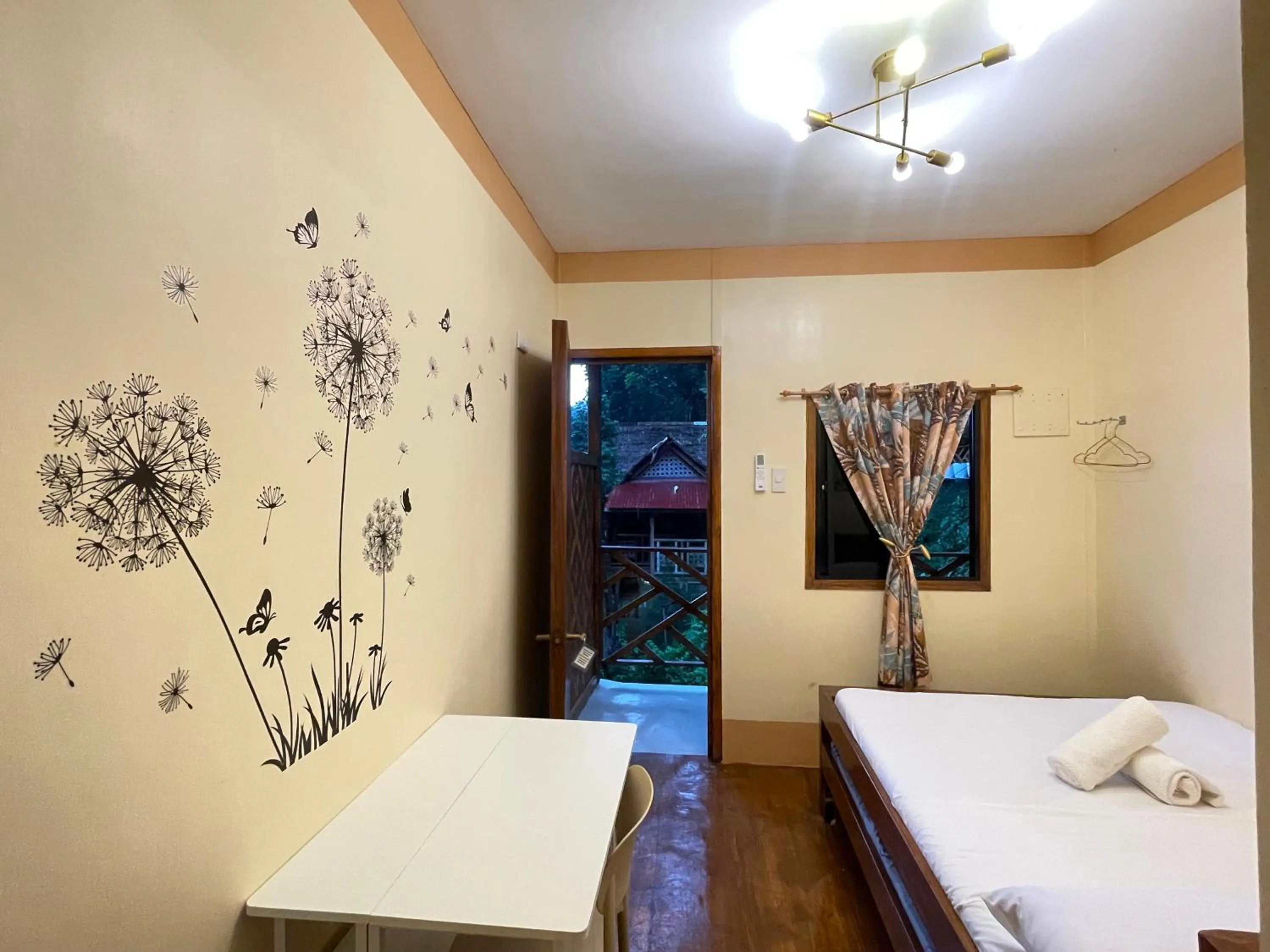 Bed in Camiguin Blue Lagoon Cottages