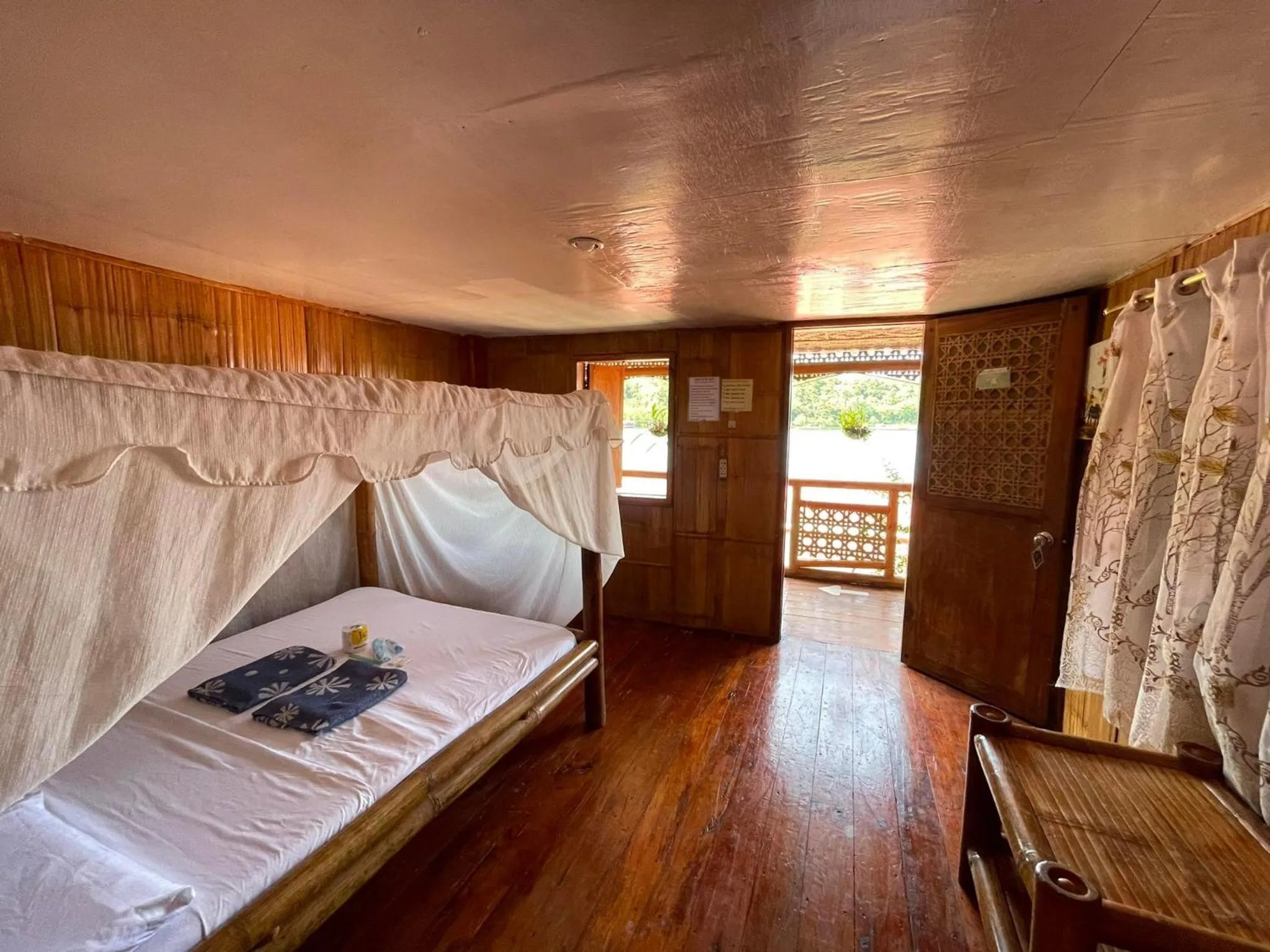 Bed in Camiguin Blue Lagoon Cottages