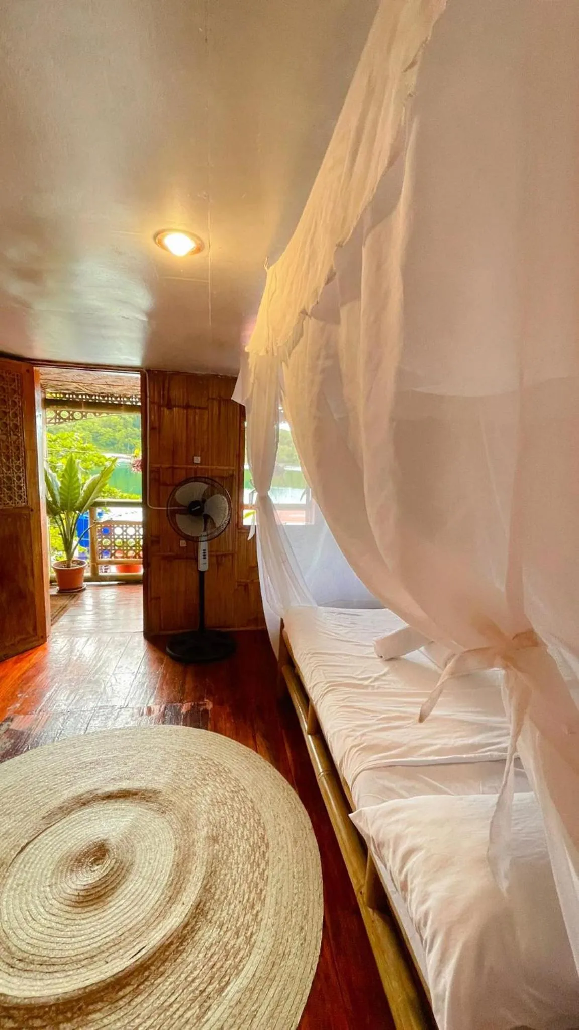 Bed in Camiguin Blue Lagoon Cottages