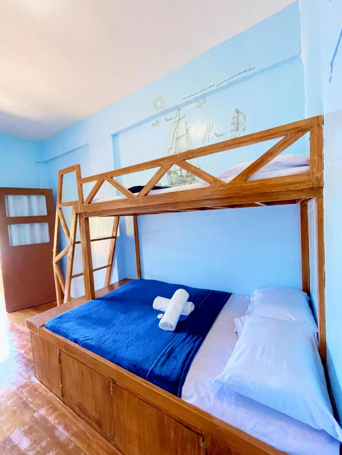 Bed in Camiguin Blue Lagoon Cottages