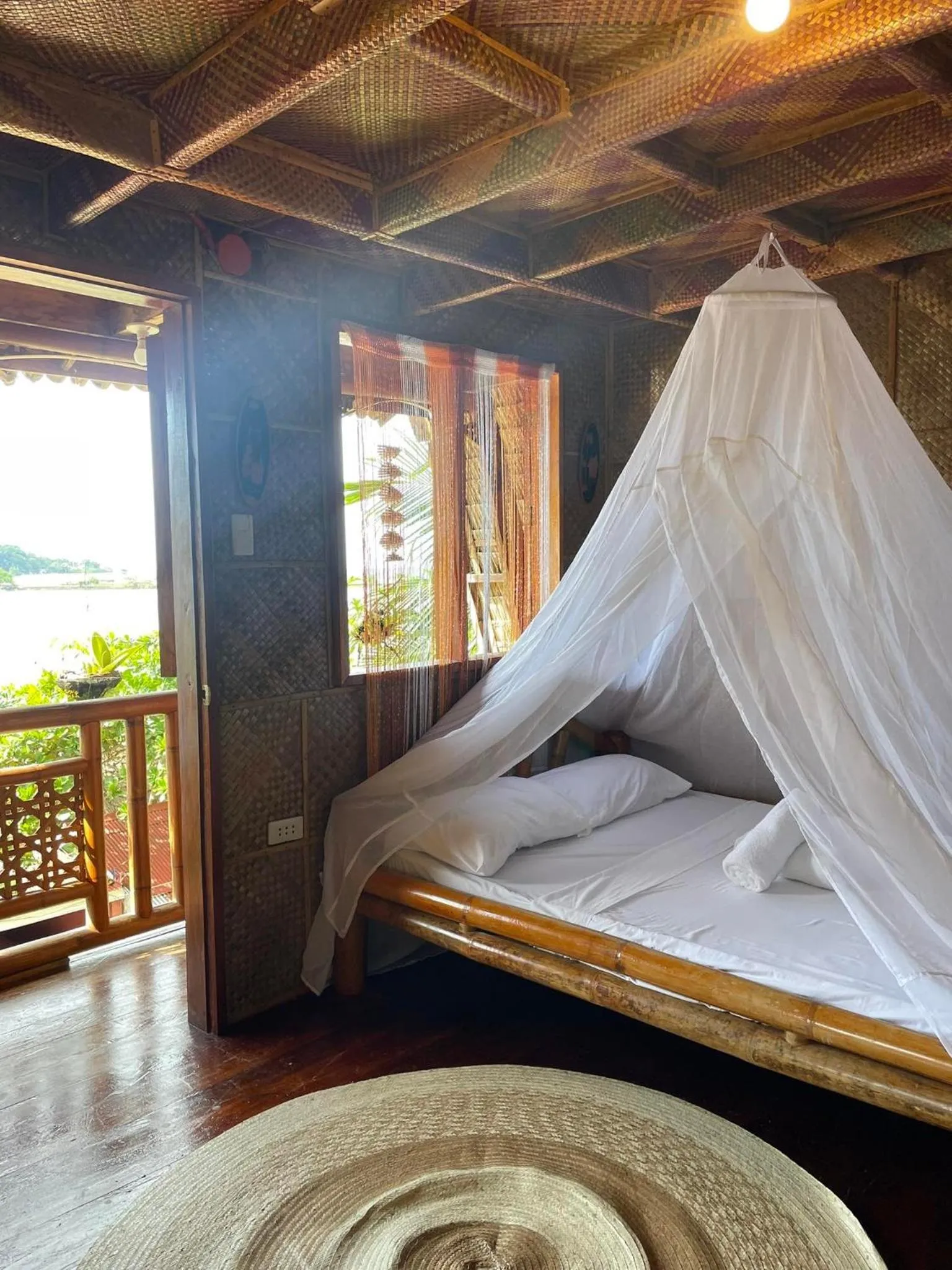 Bed in Camiguin Blue Lagoon Cottages