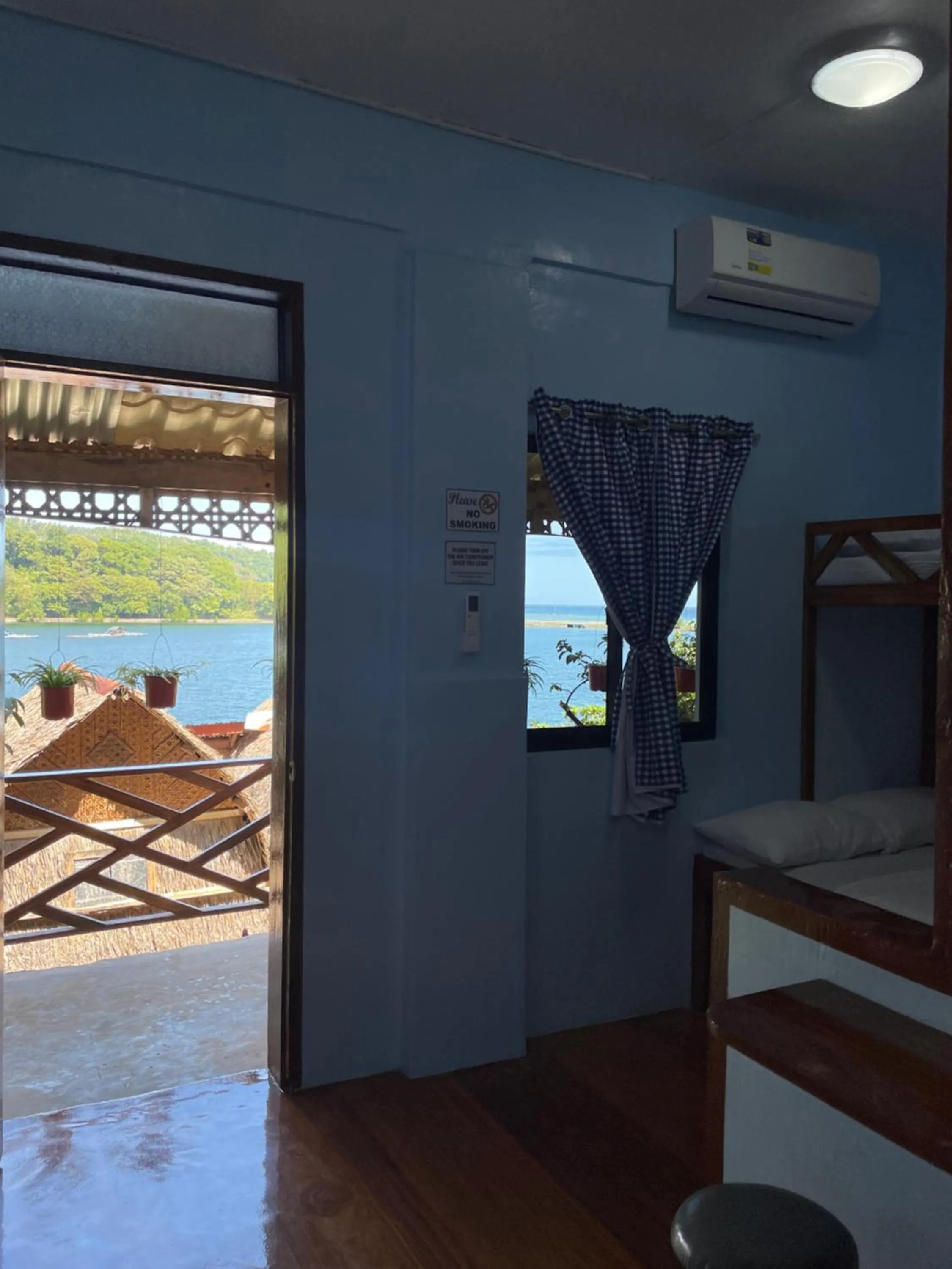 Bed in Camiguin Blue Lagoon Cottages