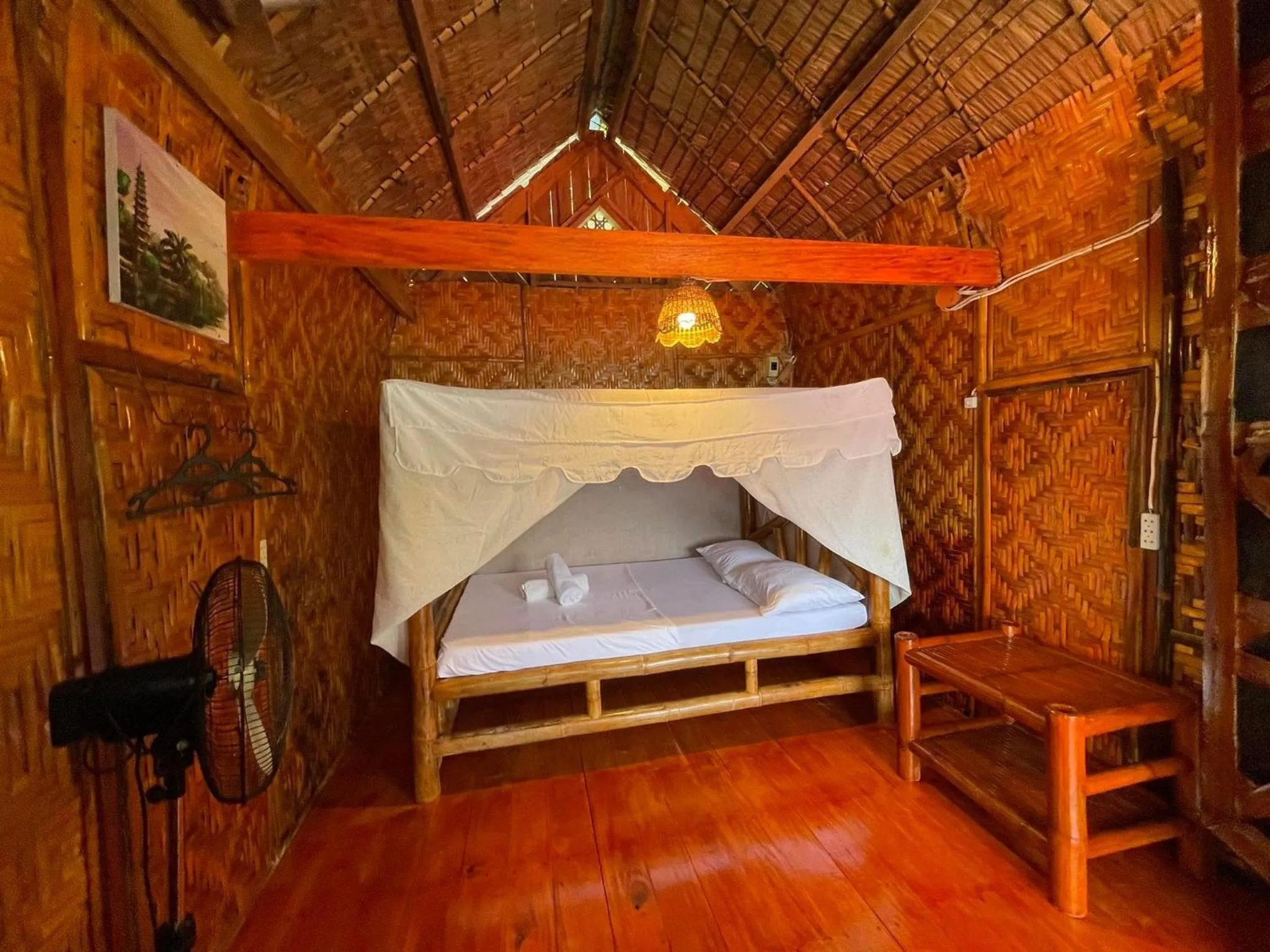 Bed in Camiguin Blue Lagoon Cottages