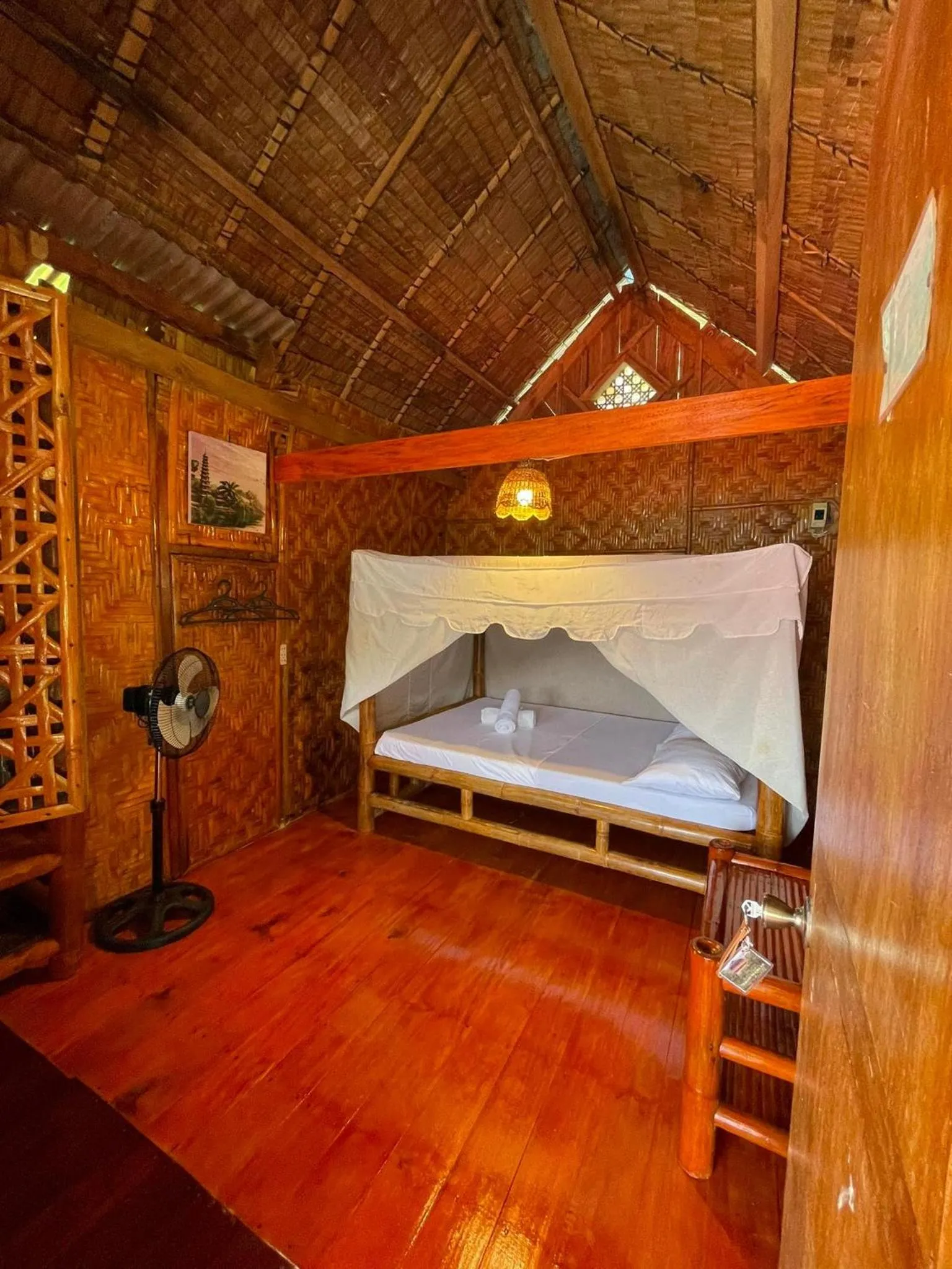 Bed in Camiguin Blue Lagoon Cottages