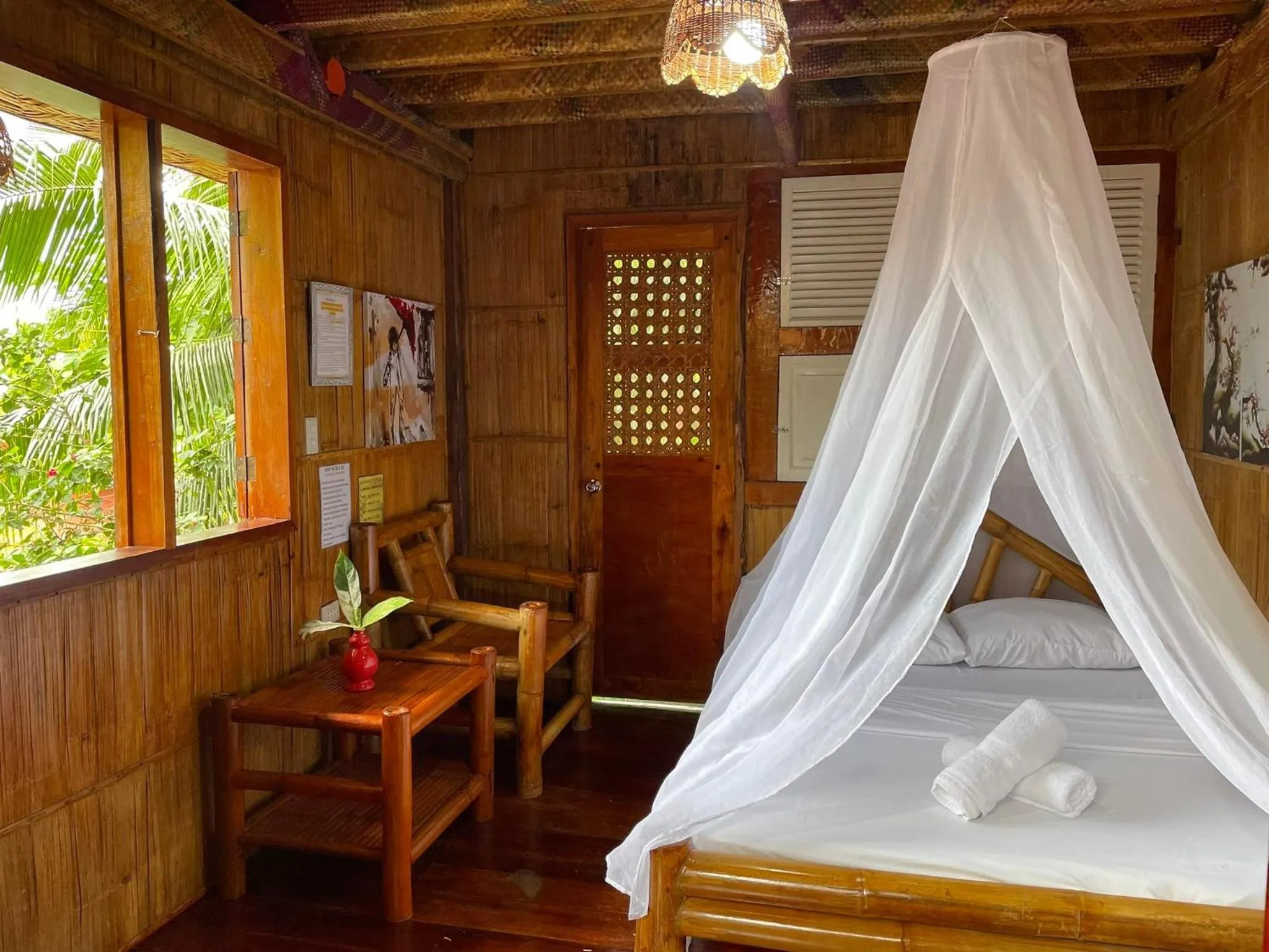 Bed in Camiguin Blue Lagoon Cottages