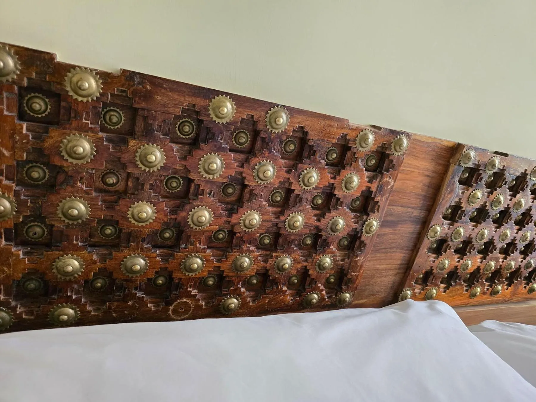 Decorative detail, Bed in Palm Gallery Hotel