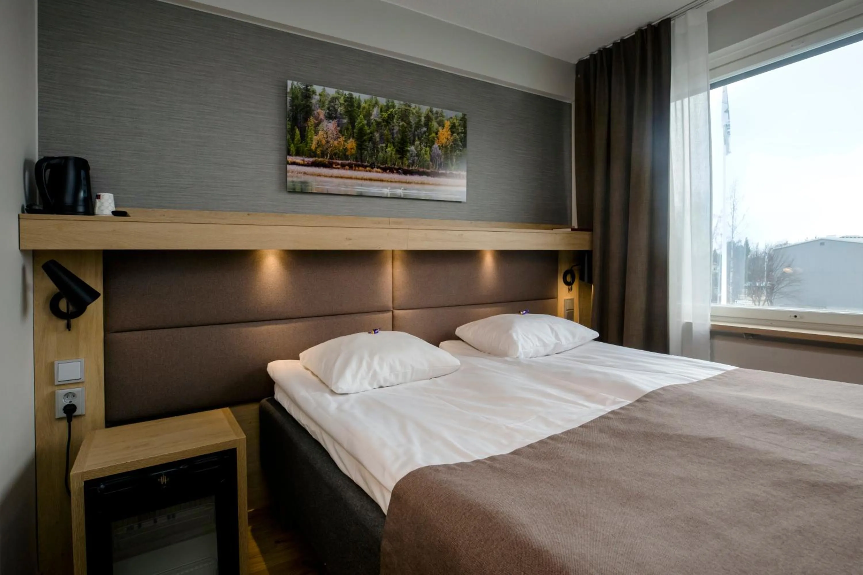 Photo of the whole room, Bed in Hotelli Toivola