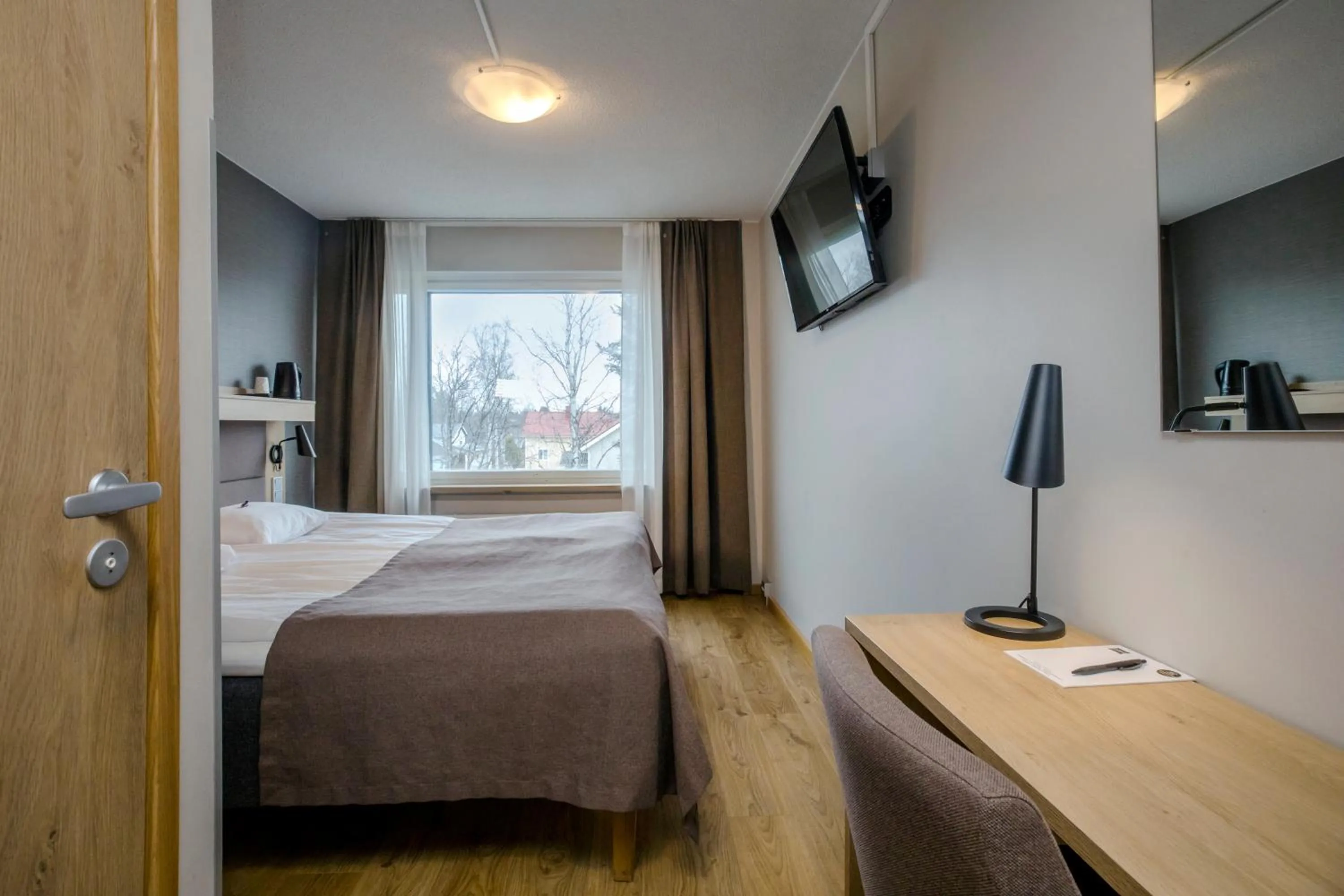 Photo of the whole room, Bed in Hotelli Toivola