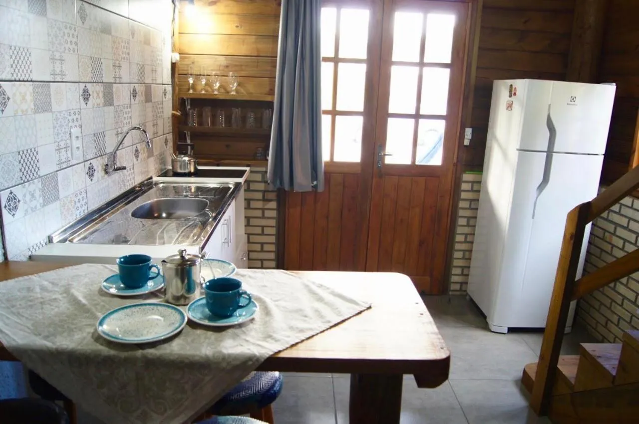 Kitchen or kitchenette in Mandala Chalés