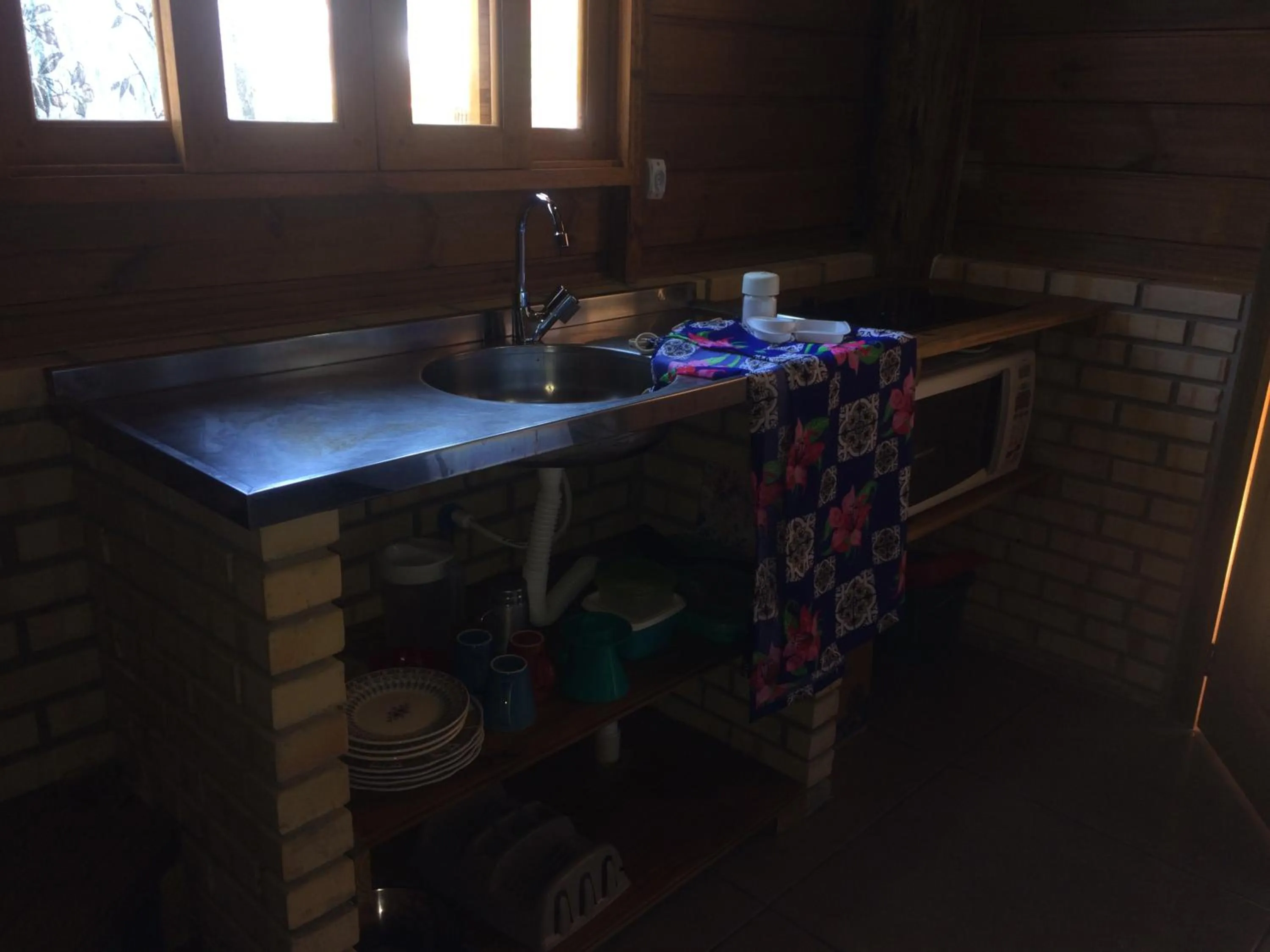 Kitchen or kitchenette in Mandala Chalés